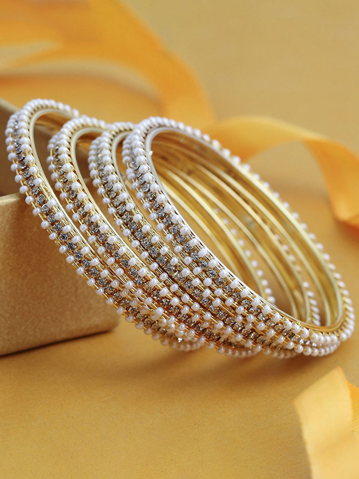 Sukkhi Fascinating Pearl Gold Plated Austrian Diamond Bangles Set of 4 for Women B71518ADRL550