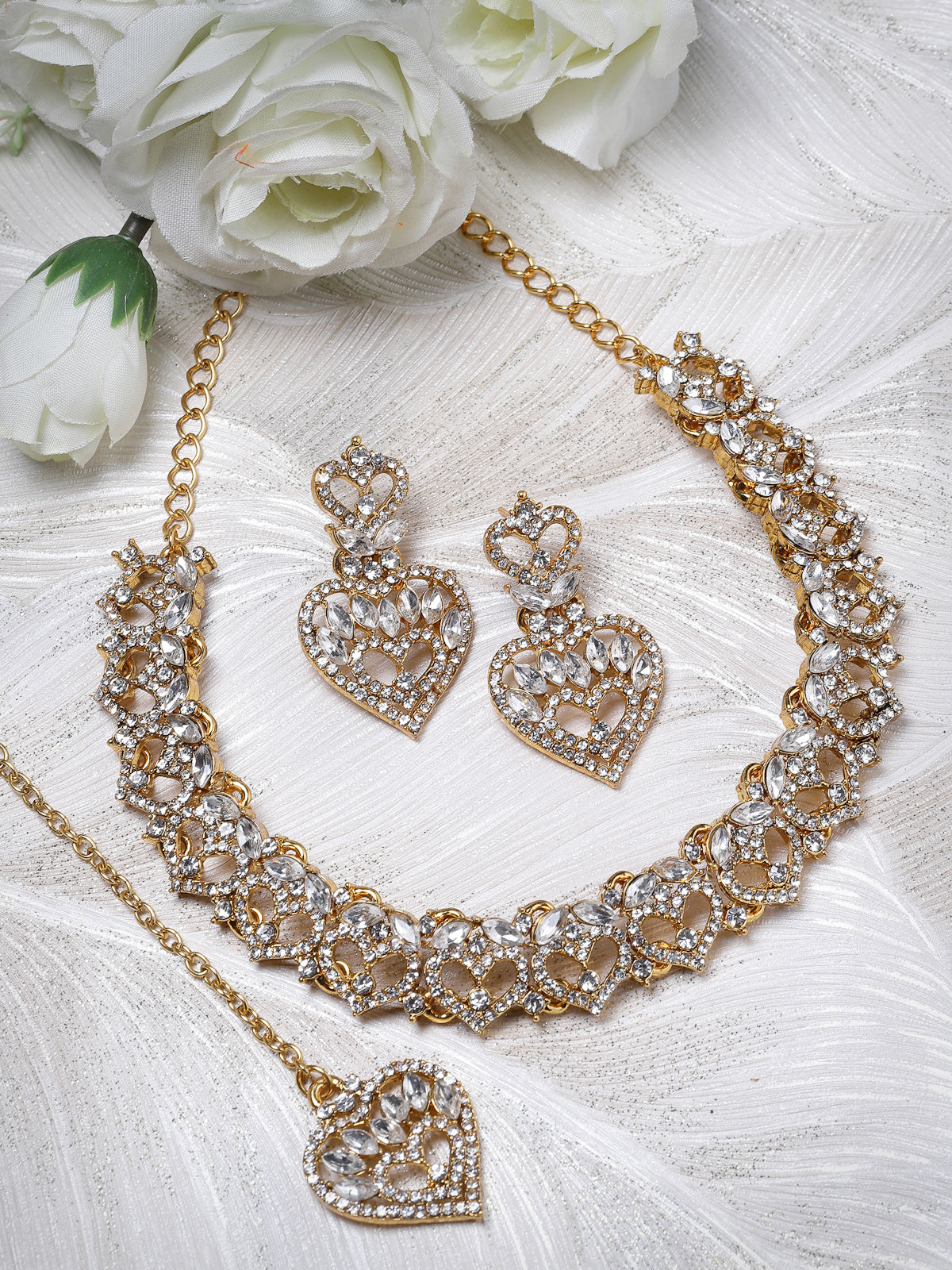 Sukkhi Wonderful Gold Plated AD White Stone Collar Bone Necklace Set With Earring And Maangtika | Jewellery Set For Women (NS105620)