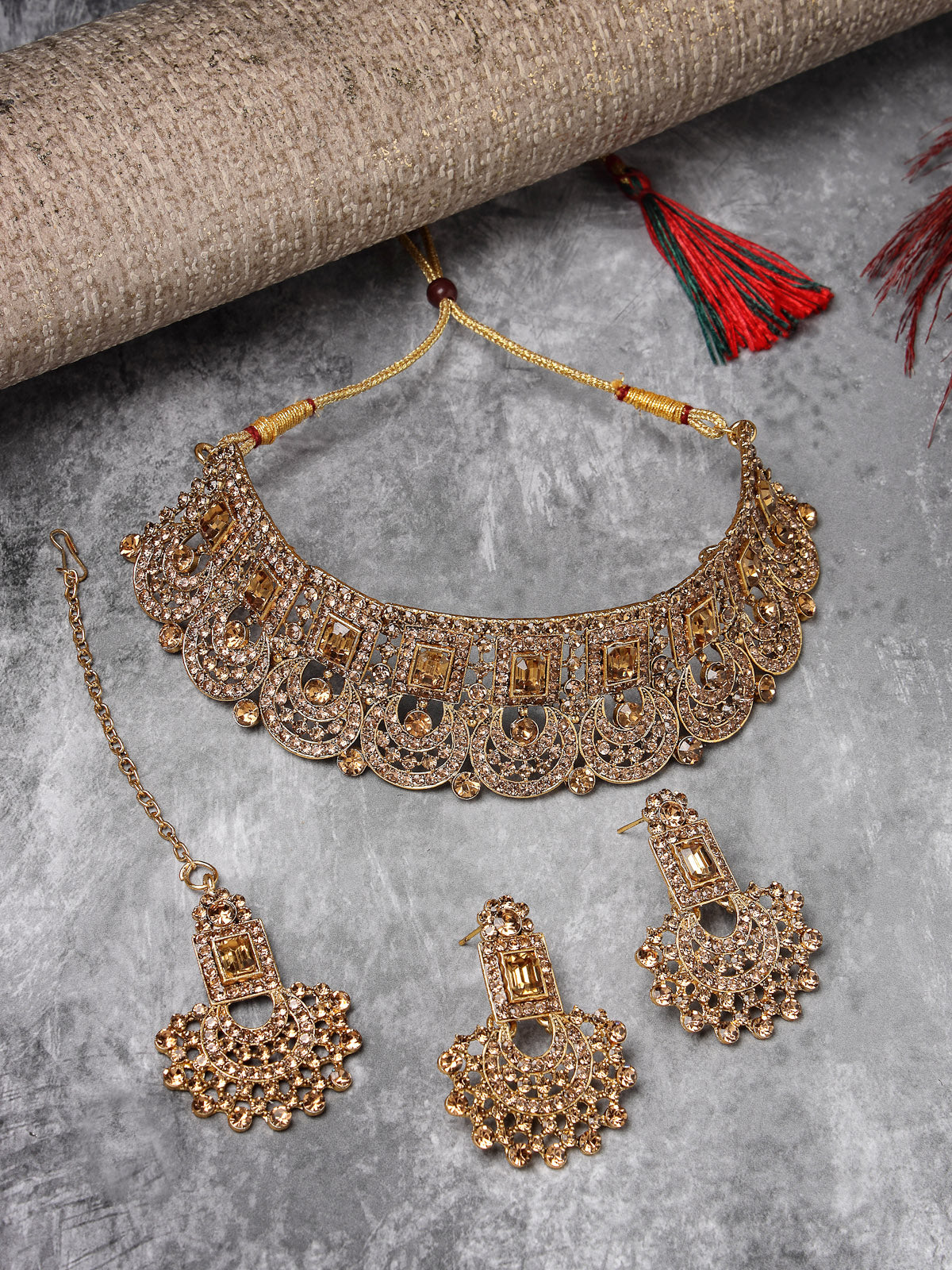 Sukkhi Graceful Curve Shaped Gold Plated Golden AD Stone Choker Necklace Set With Earring And Maangtika | Jewellery Set For Women (NS105644)