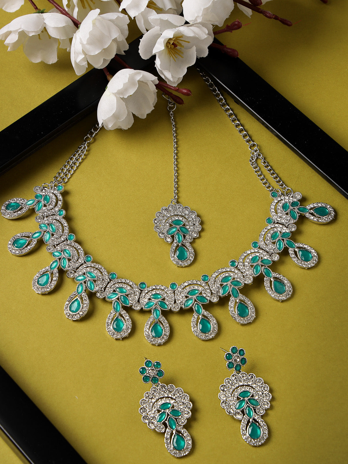 Sukkhi Alluring Traditional Rhodium Plated Green AD Stone Collar Bone Necklace Set With Earring And Maangtika | Jewellery Set For Women (NS105648)