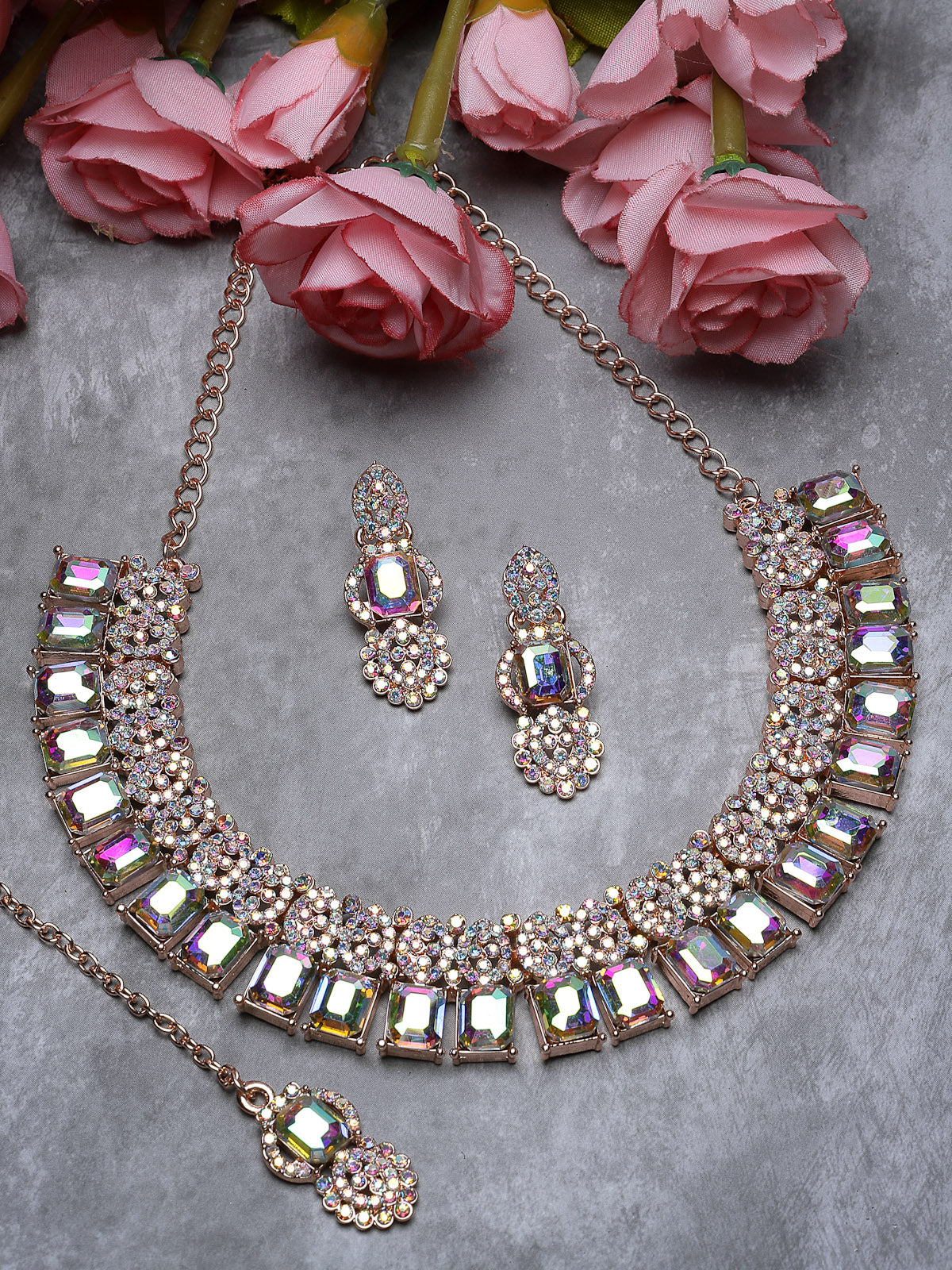 Sukkhi Striking Rose Gold Plated Rainbow Stones Collar Bone Necklace Set With Earring And Maangtika | Jewellery Set For Women (NS105697)