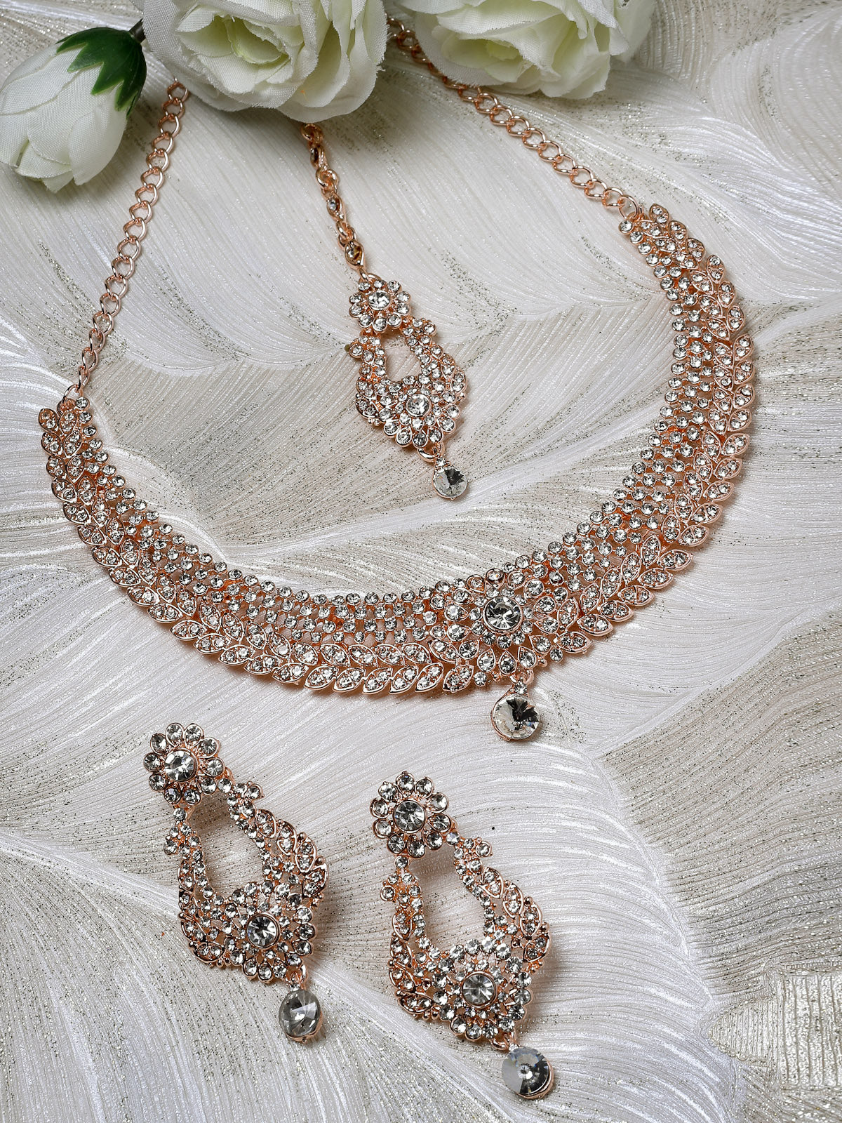 Sukkhi Glittering Rose Gold Plated AD White Stone Collar Bone Necklace Set With Earring And Maangtika | Jewellery Set For Women (NS105713)
