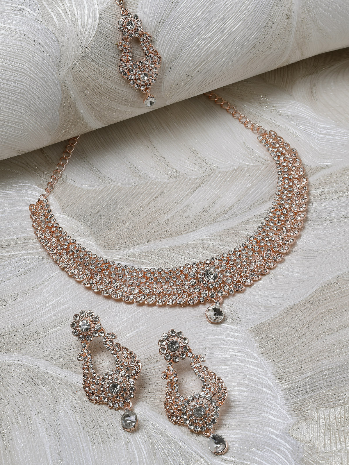 Sukkhi Glittering Rose Gold Plated AD White Stone Collar Bone Necklace Set With Earring And Maangtika | Jewellery Set For Women (NS105713)