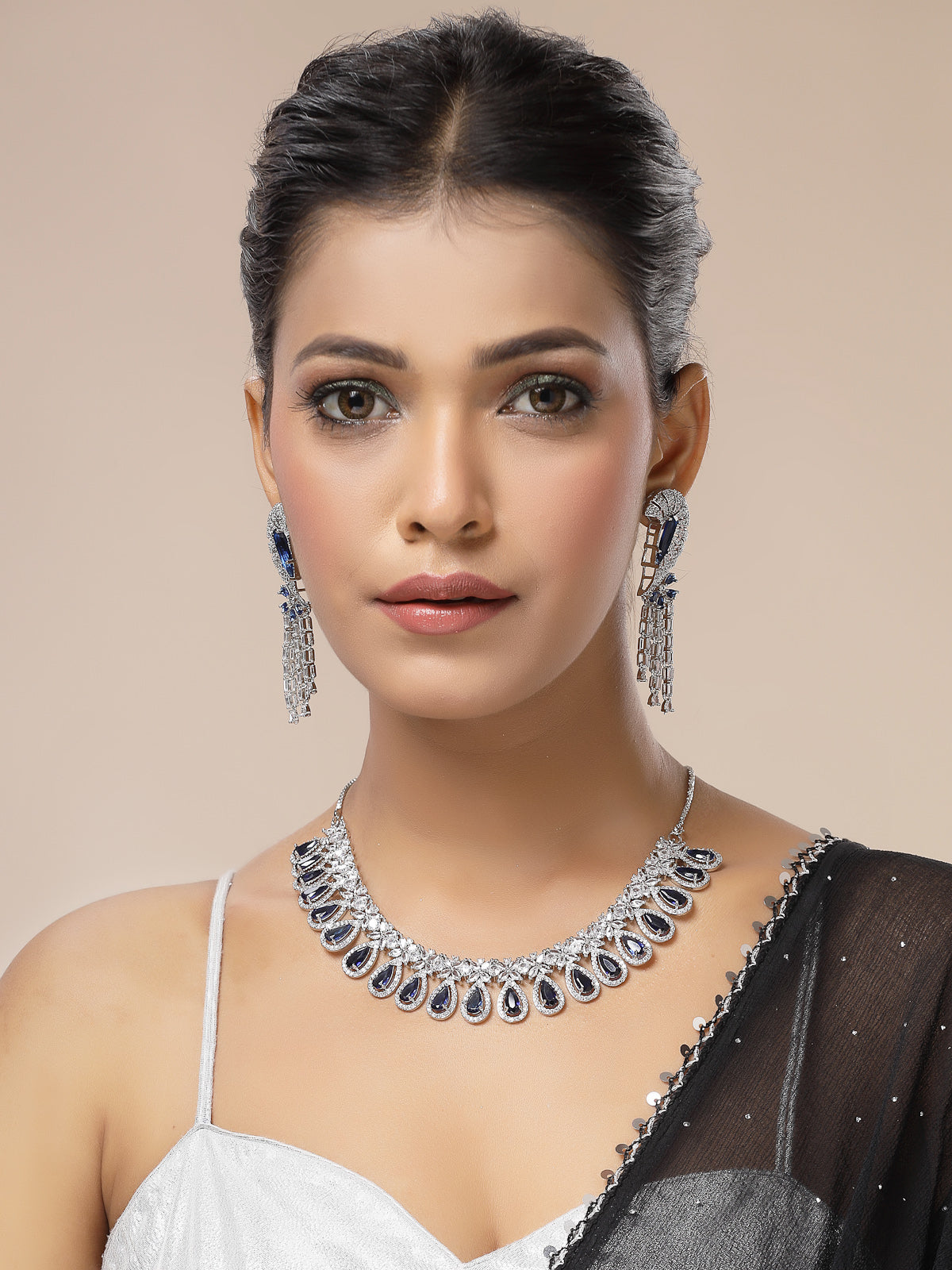 Sukkhi Lavish Fashionable Rhodium Plated Silver Toned & American Diamond StudsDrop Shaped Blue Choker Necklace With Dangle Earring Jewellery Set for Women & Girls|NS107409