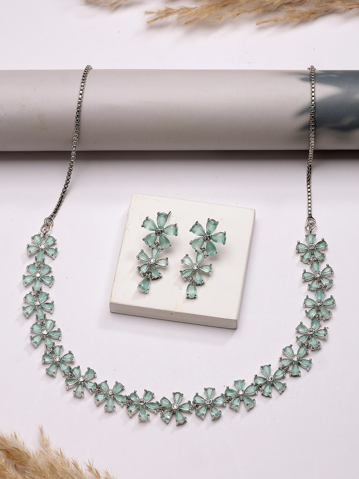 Sukkhi Attractive Rhodium Plated Silver Toned with American Diamond Studded Floral Shaped Sea Green Choker Necklace with Drop Earring Jewellery Set For Women & Girls|NS107418