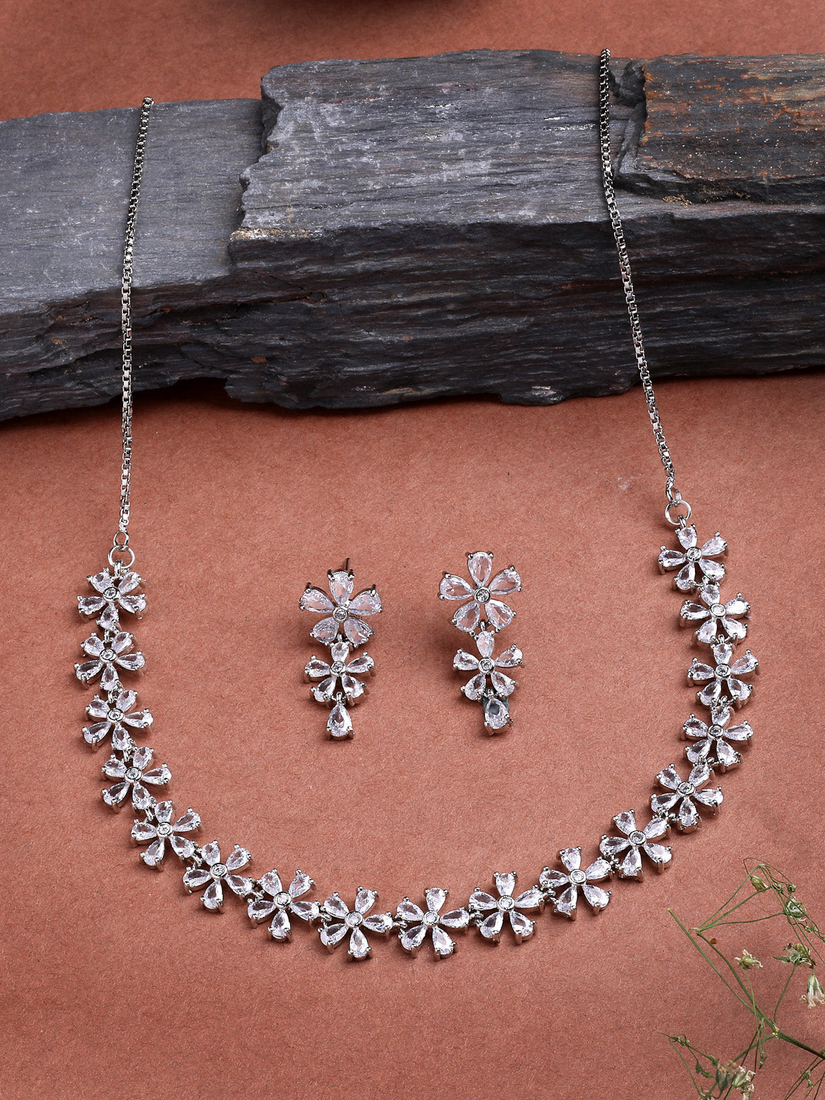 Sukkhi Attractive Rhodium Plated Silver Toned with American Diamond Studded Floral Shaped Choker Necklace with Drop Earring Jewellery Set For Women & Girls|NS107419