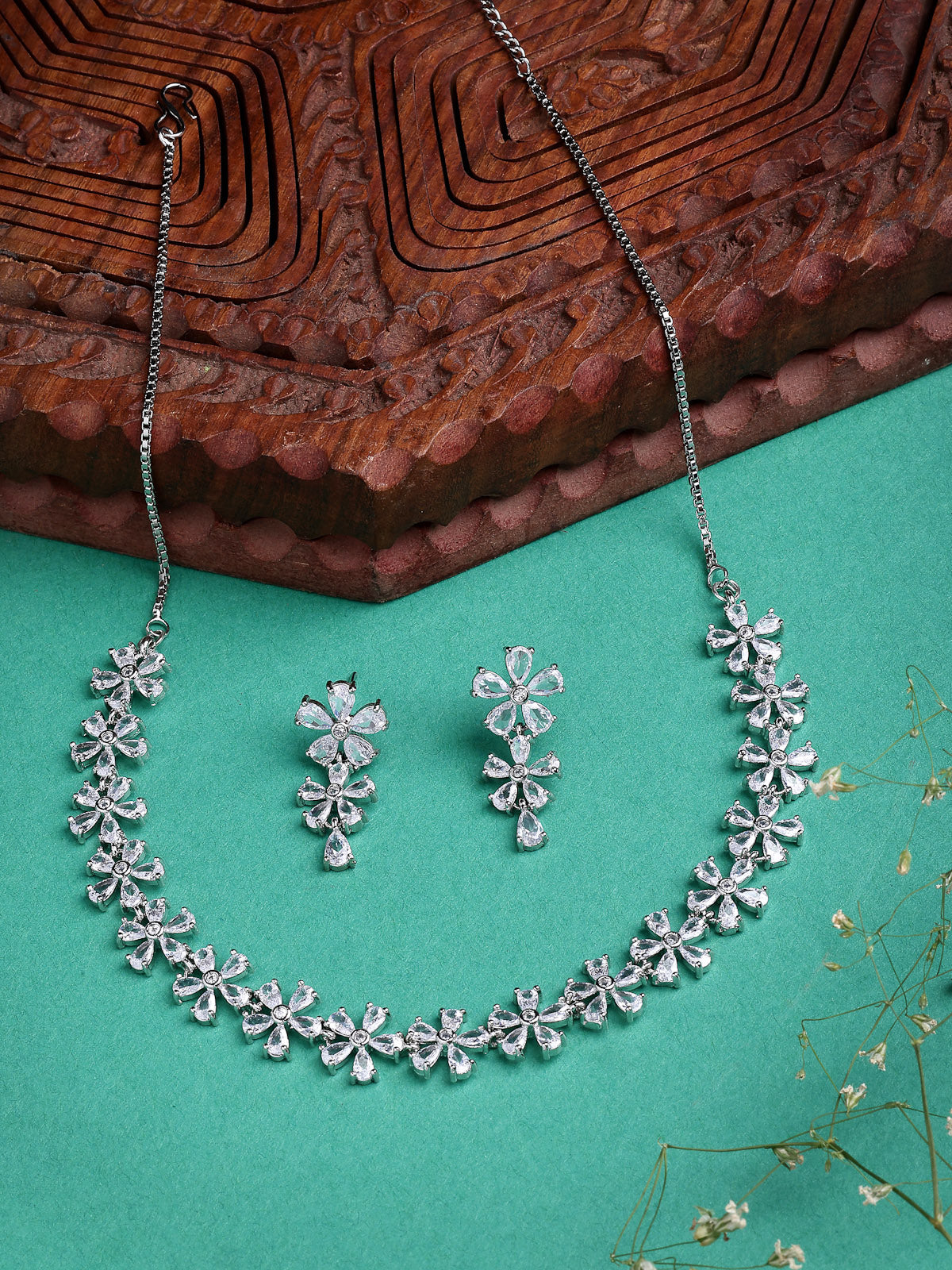 Sukkhi Attractive Rhodium Plated Silver Toned with American Diamond Studded Floral Shaped Choker Necklace with Drop Earring Jewellery Set For Women & Girls|NS107419