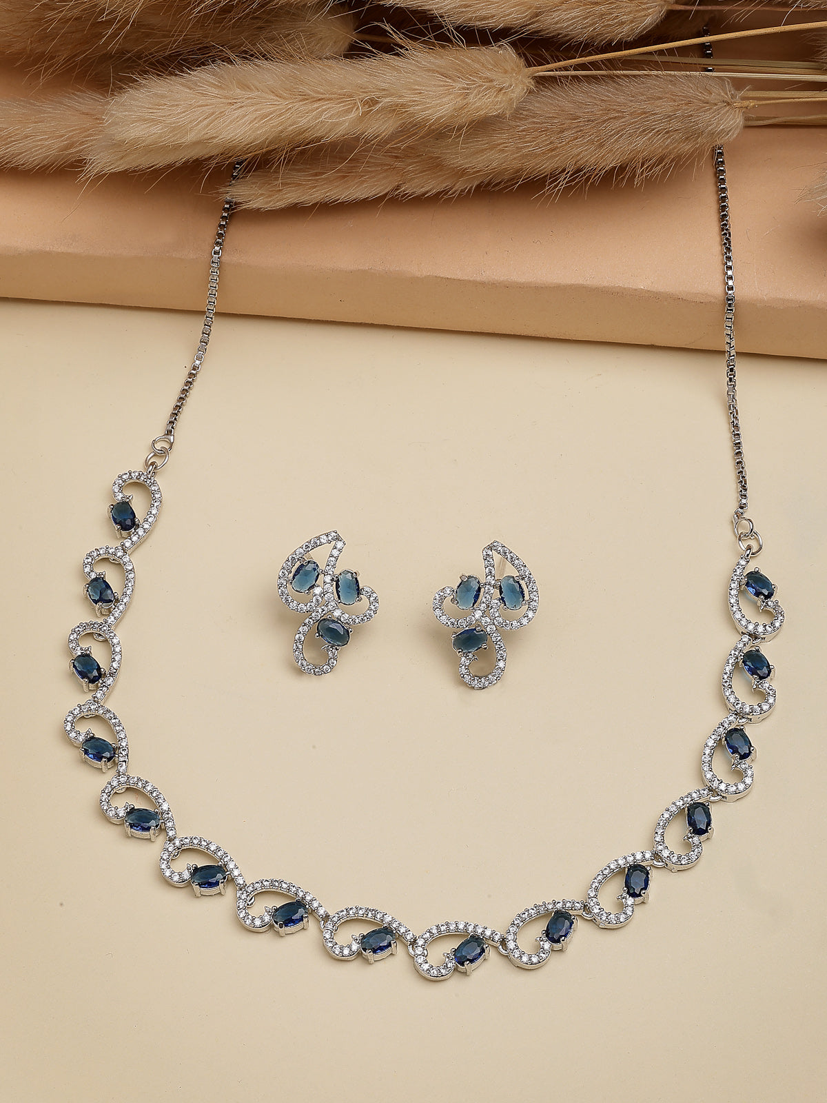 Sukkhi Western Fashion Style Rhodium Plated with Silver Toned Cubic Zirconia Stones Studded Blue Choker Necklace with Studs Earring Jewellery Set For Women & Girls|NS107426