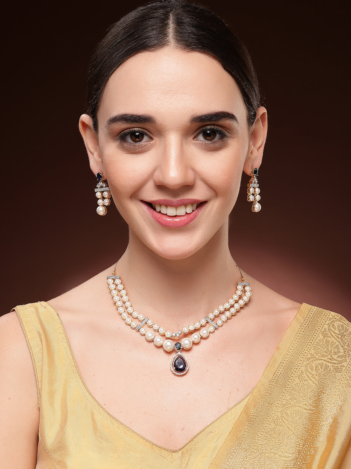 Sukkhi Glamorous Blue Pear Design Gold Plated CZ & Pearl Studded Brass Two Layered Collar Necklace with Drop Earrings Jewellery Set for Women|Latest Stylish Gifts for All Occasions|NS116051