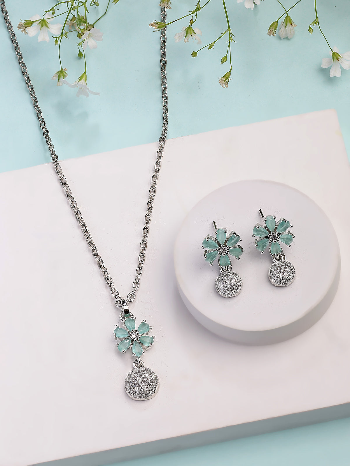 Sukkhi Nice-Looking Stylish Rhodium Plated Silver Toned Green Cubic Zirconia Studded Floral Shaped Cute Pendant with Box Chain & Drop Earrings Jewellery Set for Women & Girls |PS107432