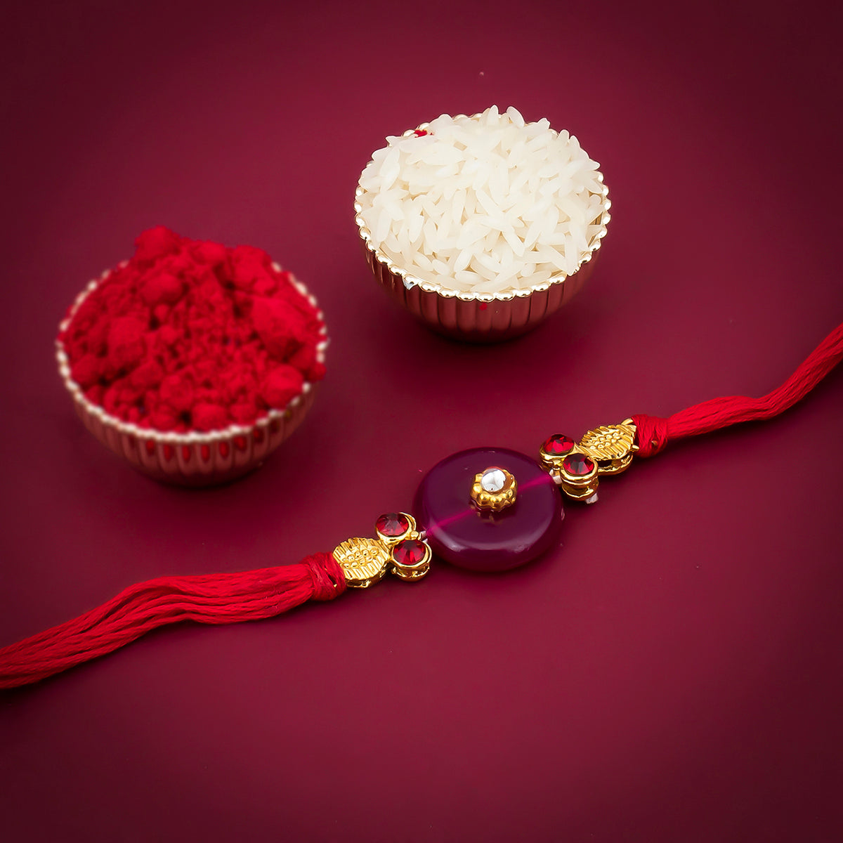 Sukkhi Fabulous Gold Plated Red Rakhi with Roli Chawal and Raksha Bandhan Greeting Card For Men
