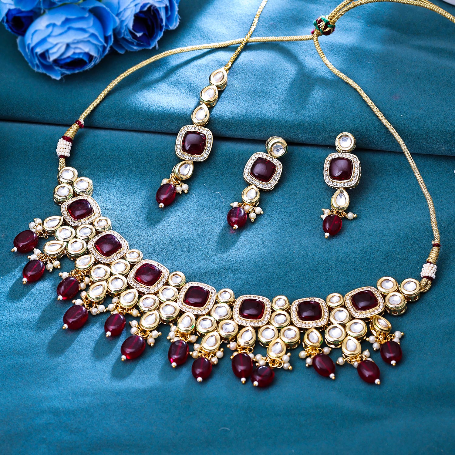Sukkhi Engaging Gold Plated Kundan & Pearl Maroon Necklace Set for Women