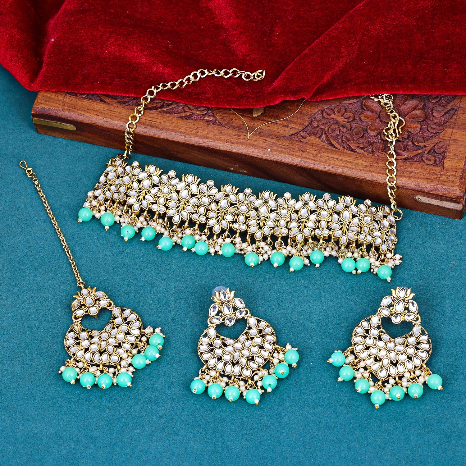 Sukkhi fetching Green Kundan & Pearl Gold Plated Choker Necklace Set for Women