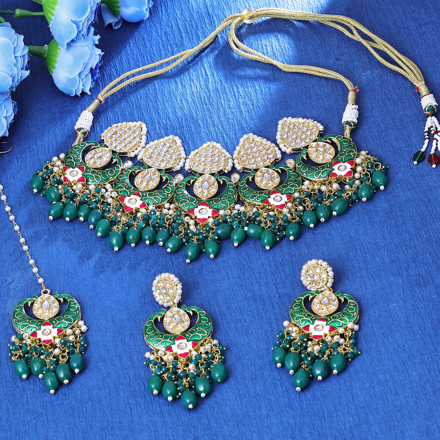 Sukkhi Inviting Gold Plated Green Color Stone Collar Necklace Set With Maang Tikka for Women