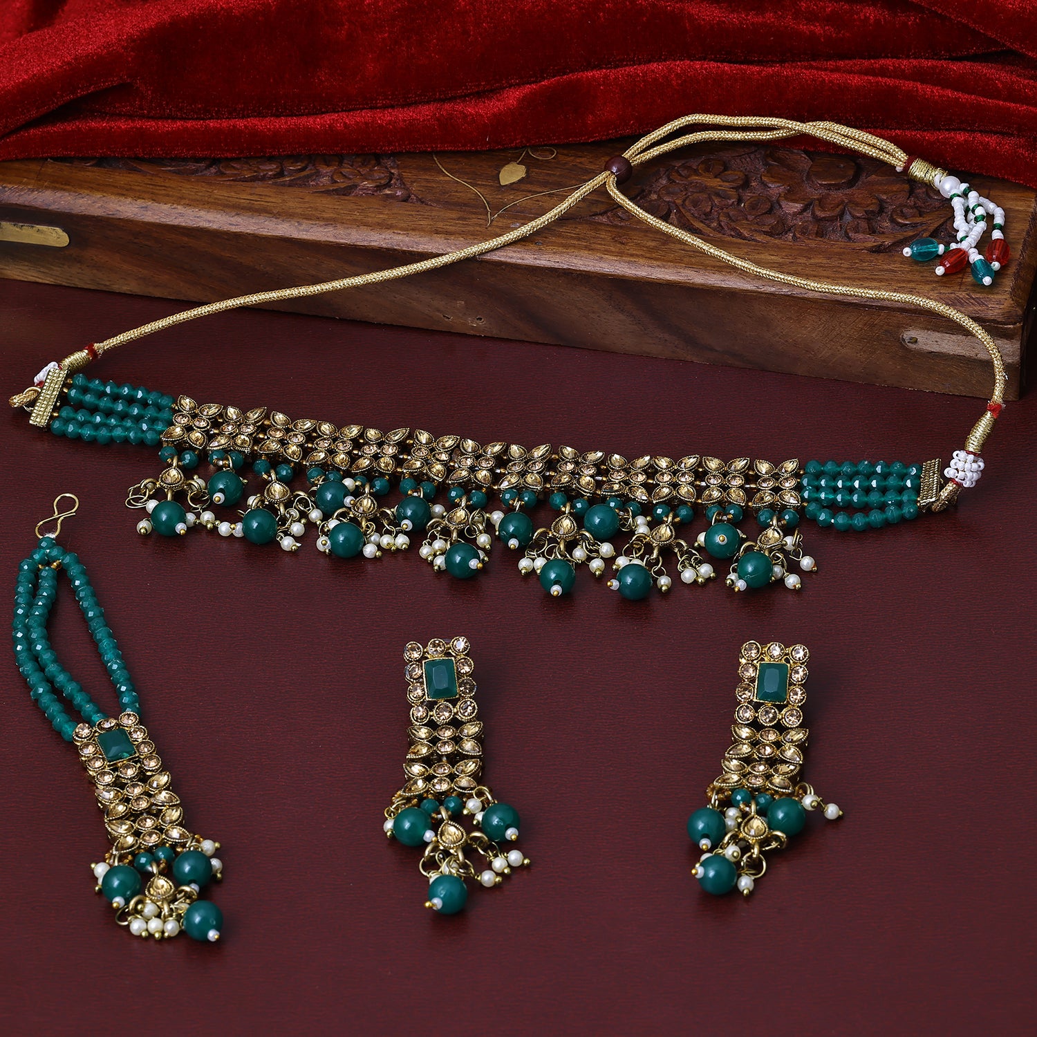 Sukkhi Knockout Gold Plated Dark Green Austrian Stone Choker Necklace Set With Maang Tikka for Women