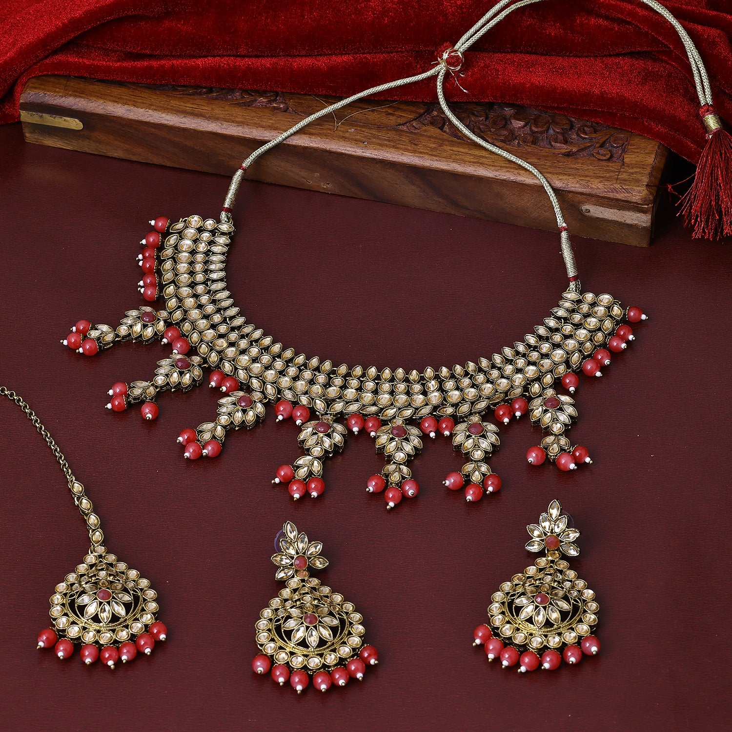 Sukkhi Stunning Gold Plated Red Austrian Stone Collar Necklace Set With Maang Tikka for Women