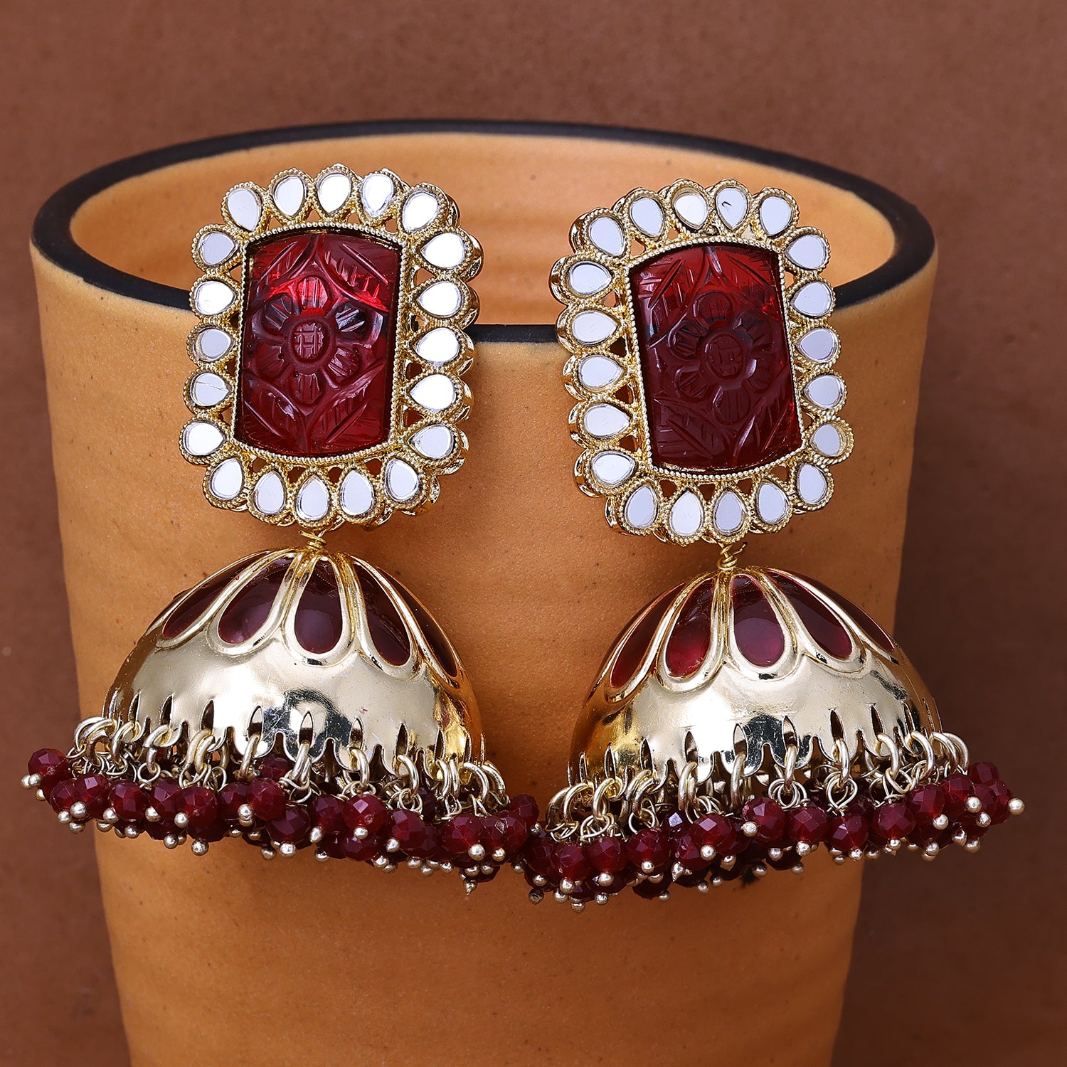 Sukkhi Comely Gold Plated Maroon Color Stone Jhumki Earrings for Women