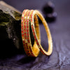 Sukkhi Fascinating Pink And Golden Color Stone Gold Plated Traditional Set Of 4 Bangles for Women