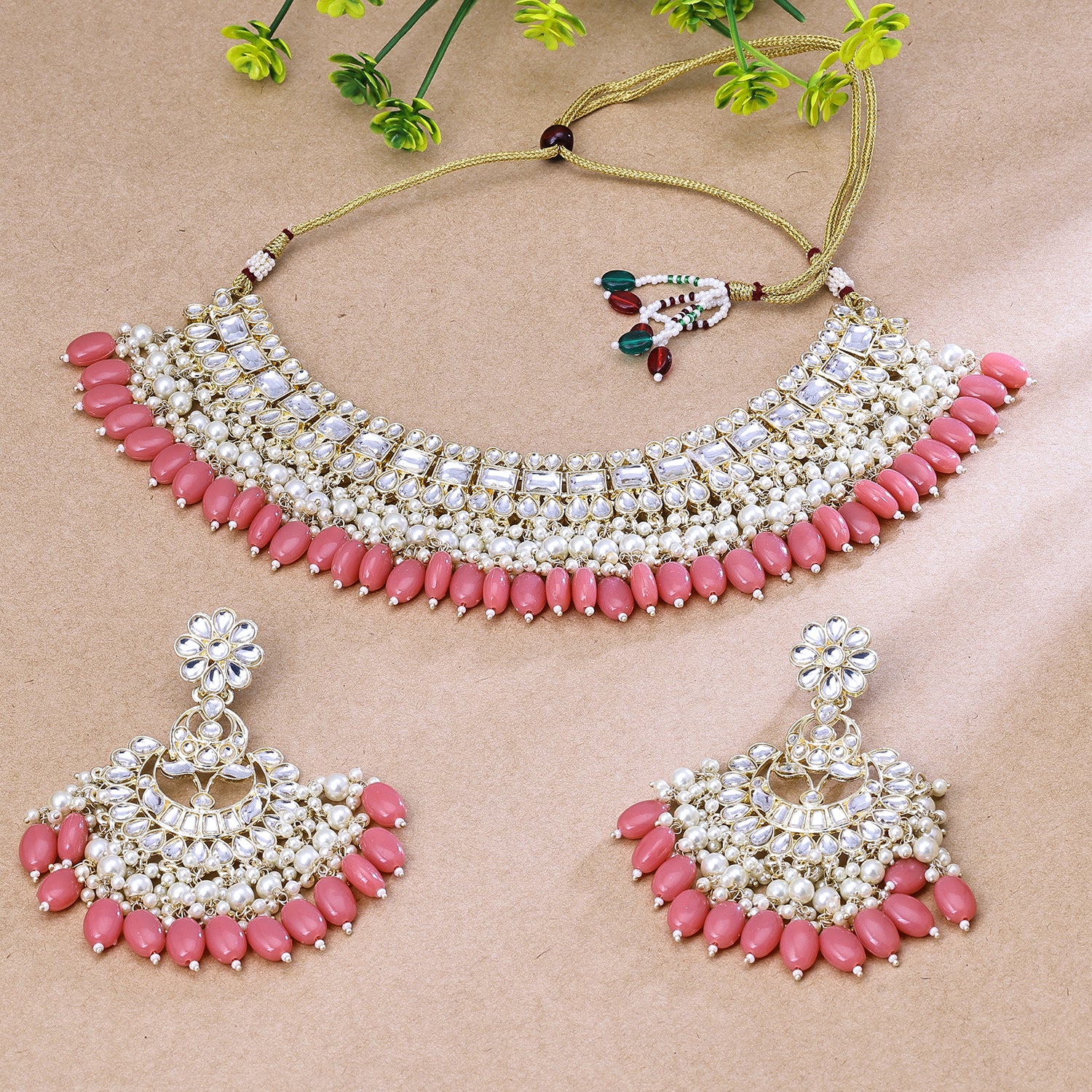 Sukkhi Gripping Light Pink And Golden Austrian Stone Gold Plated Traditional Necklace Set for Women