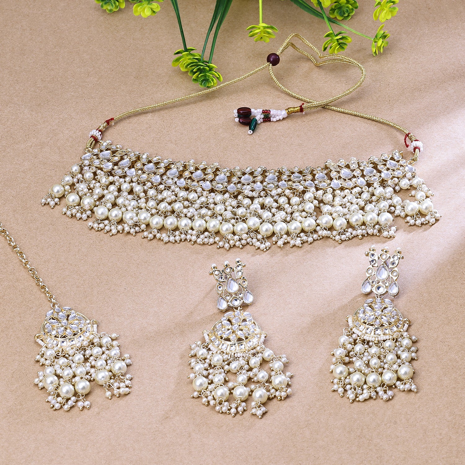 Sukkhi Hypnotizing Golden Kundan Gold Plated Traditional Necklace Set With Maang Tikka for Women