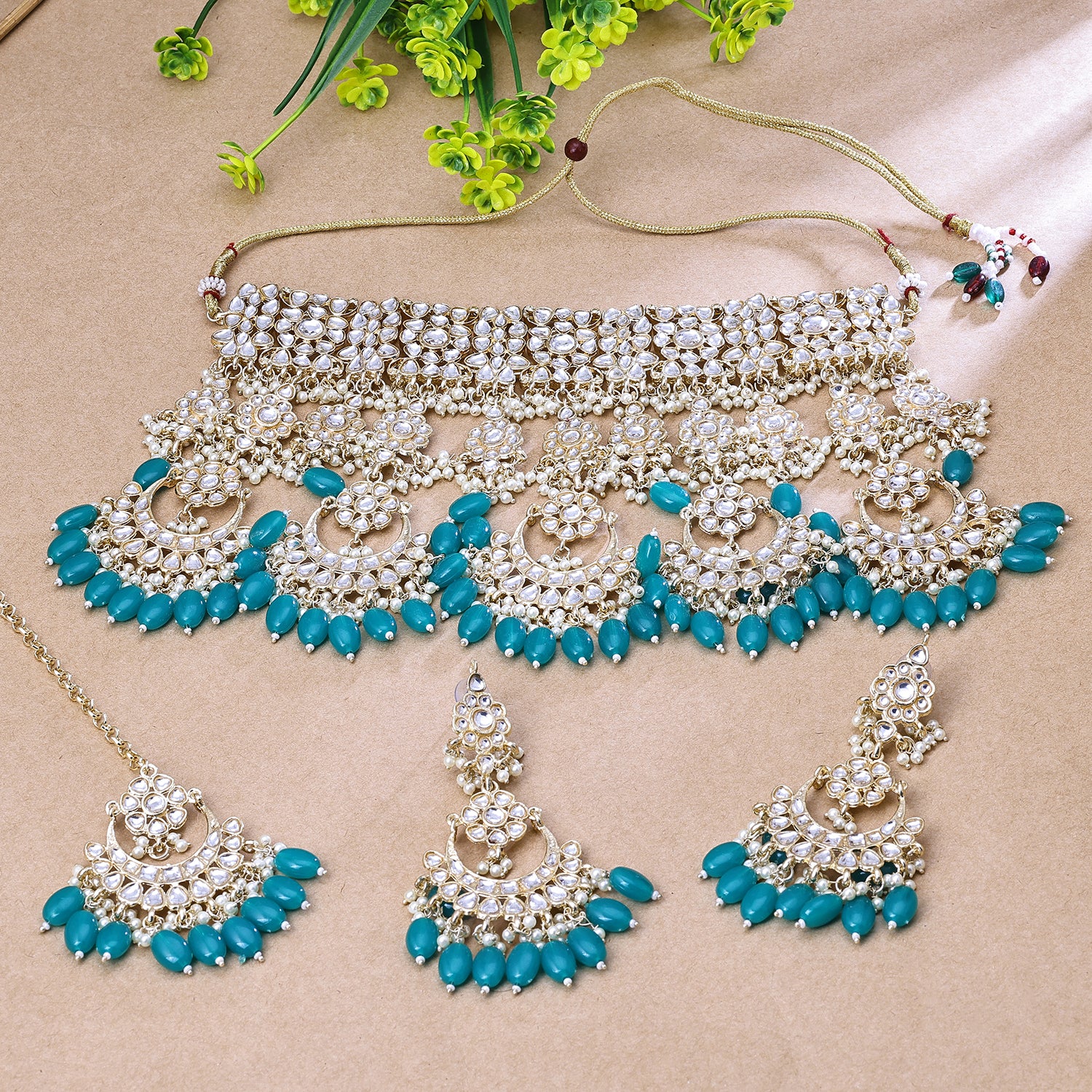 Sukkhi Haunting Blue And Golden Austrian Stone Gold Plated Traditional Necklace Set With Maang Tikka for Women