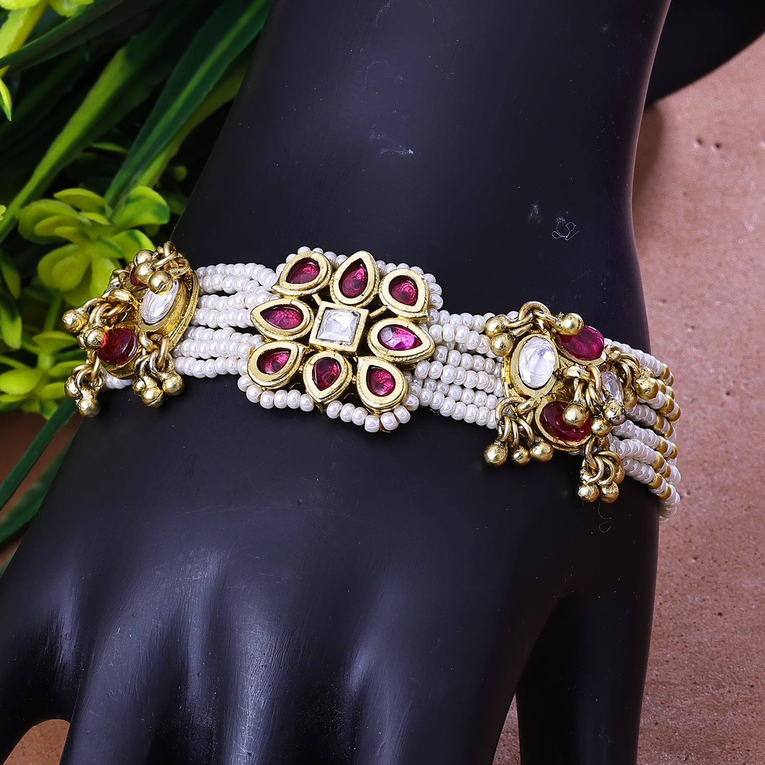 Sukkhi Enticing Pink And White Kundan And Pearl Gold Plated Party Wear Bracelet for Women