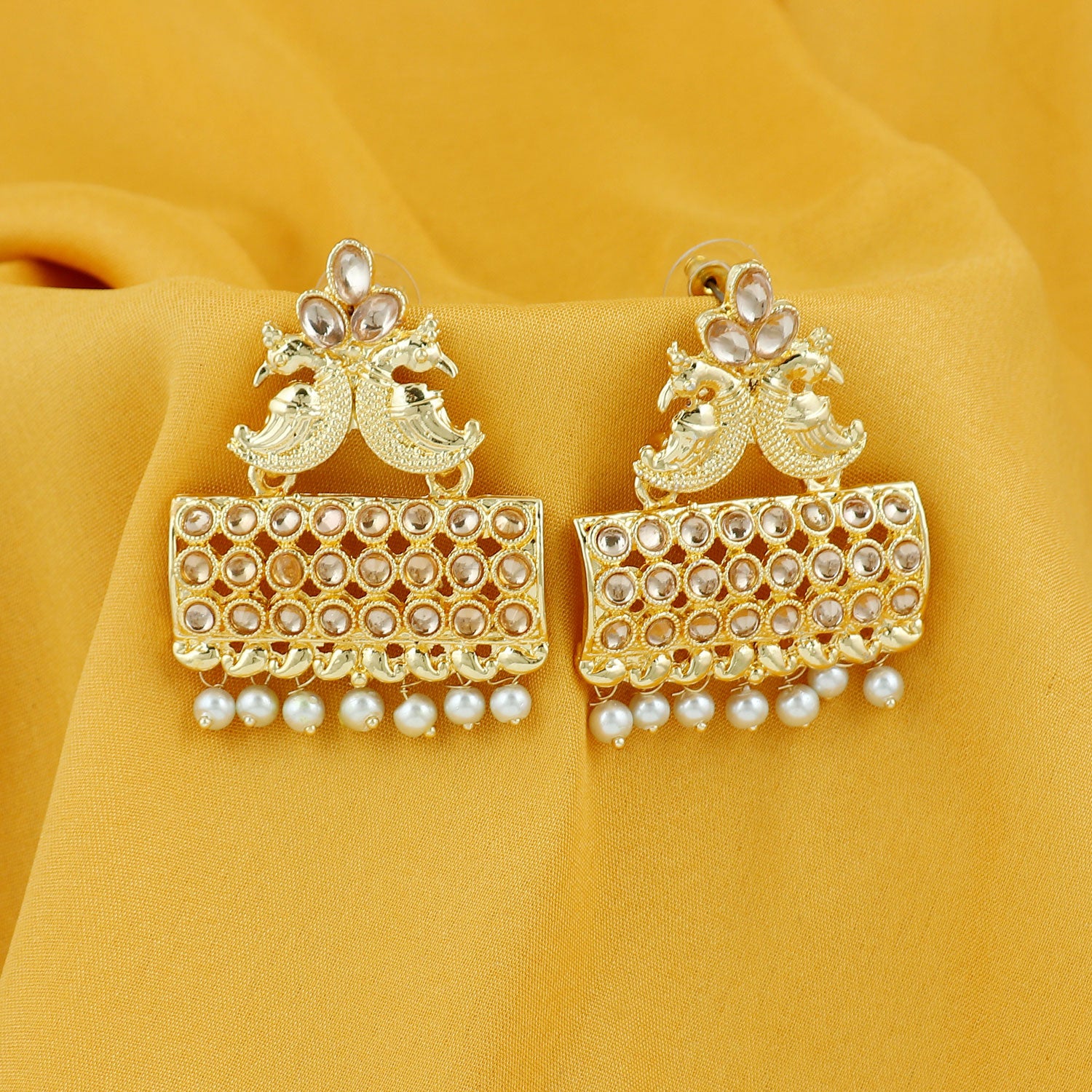Sukkhi Glimmery Pearl Gold Plated Peacock Dangle Earring For Women