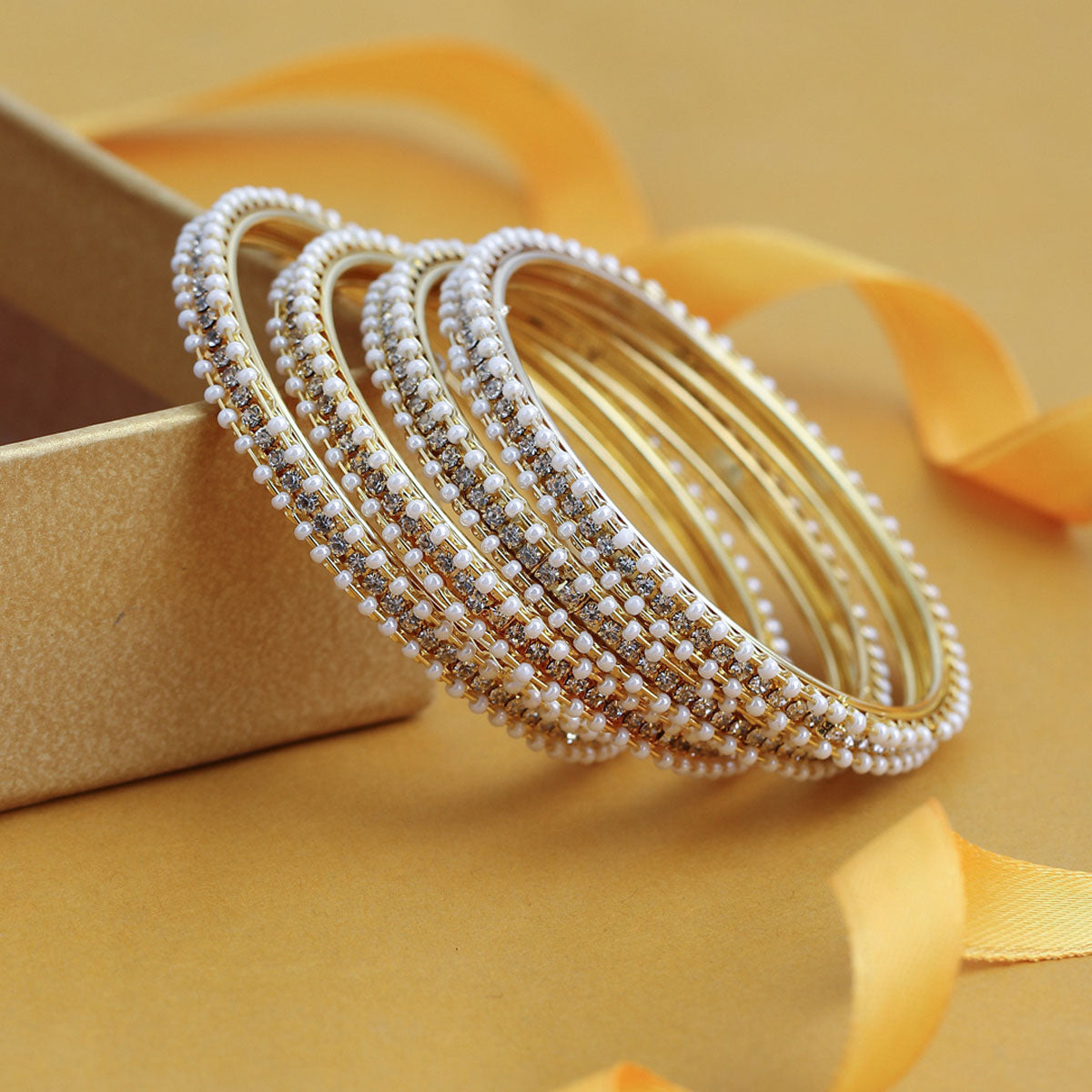 Sukkhi Fascinating Pearl Gold Plated Austrian Diamond Bangles Set of 4 for Women B71518ADRL550