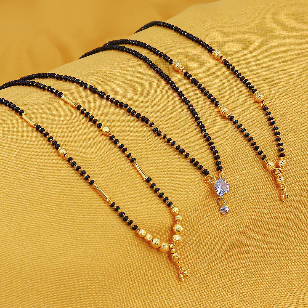 Sukkhi Sparkling Gold Plated Cz Solitaire Mangalsutra Combo For Women CB72788GLDPD032018