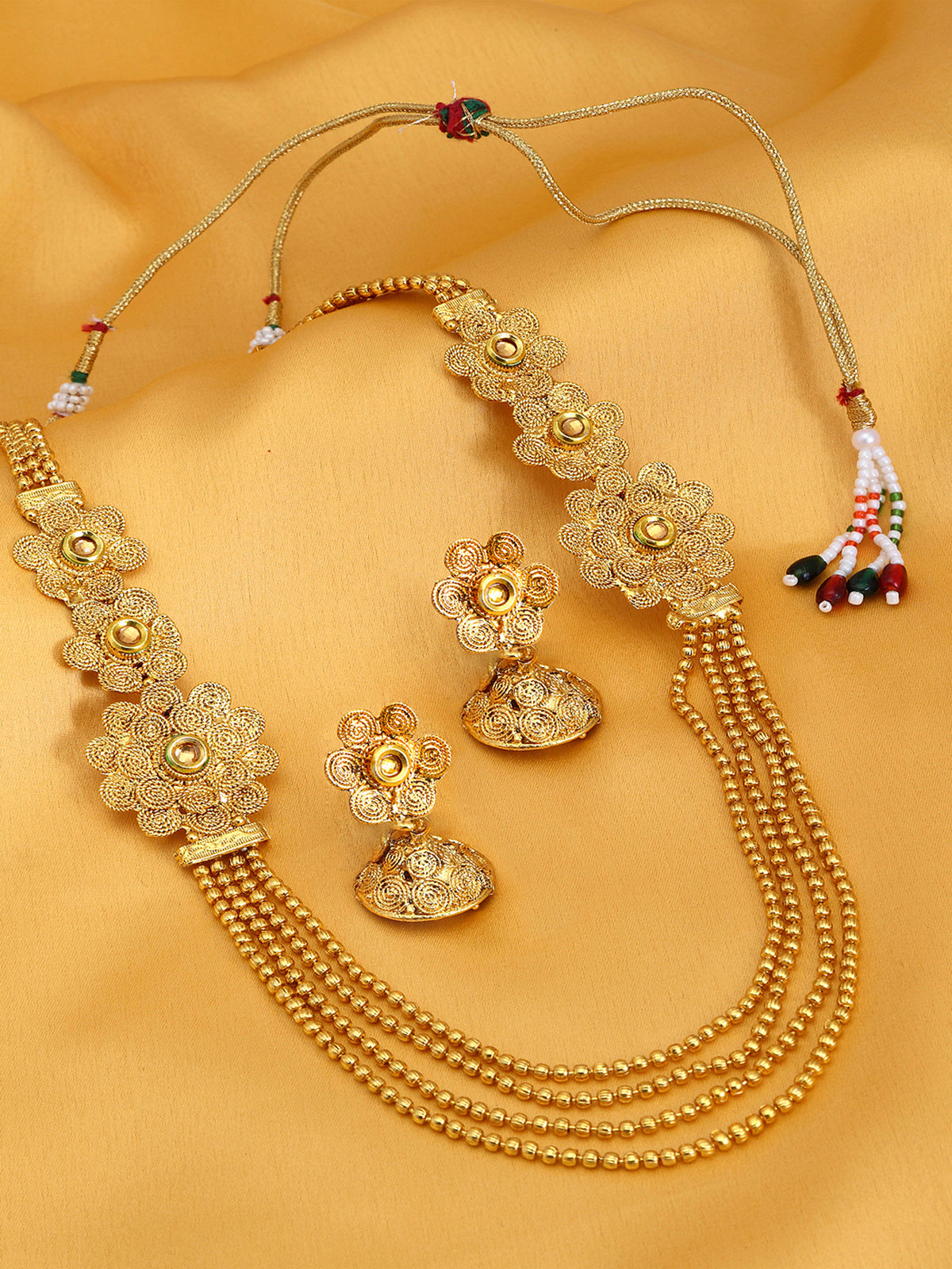 Sukkhi Pleasing 4 String Jalebi Gold Plated Alloy Long Haram Necklace Set For Women N71498GLDPH850