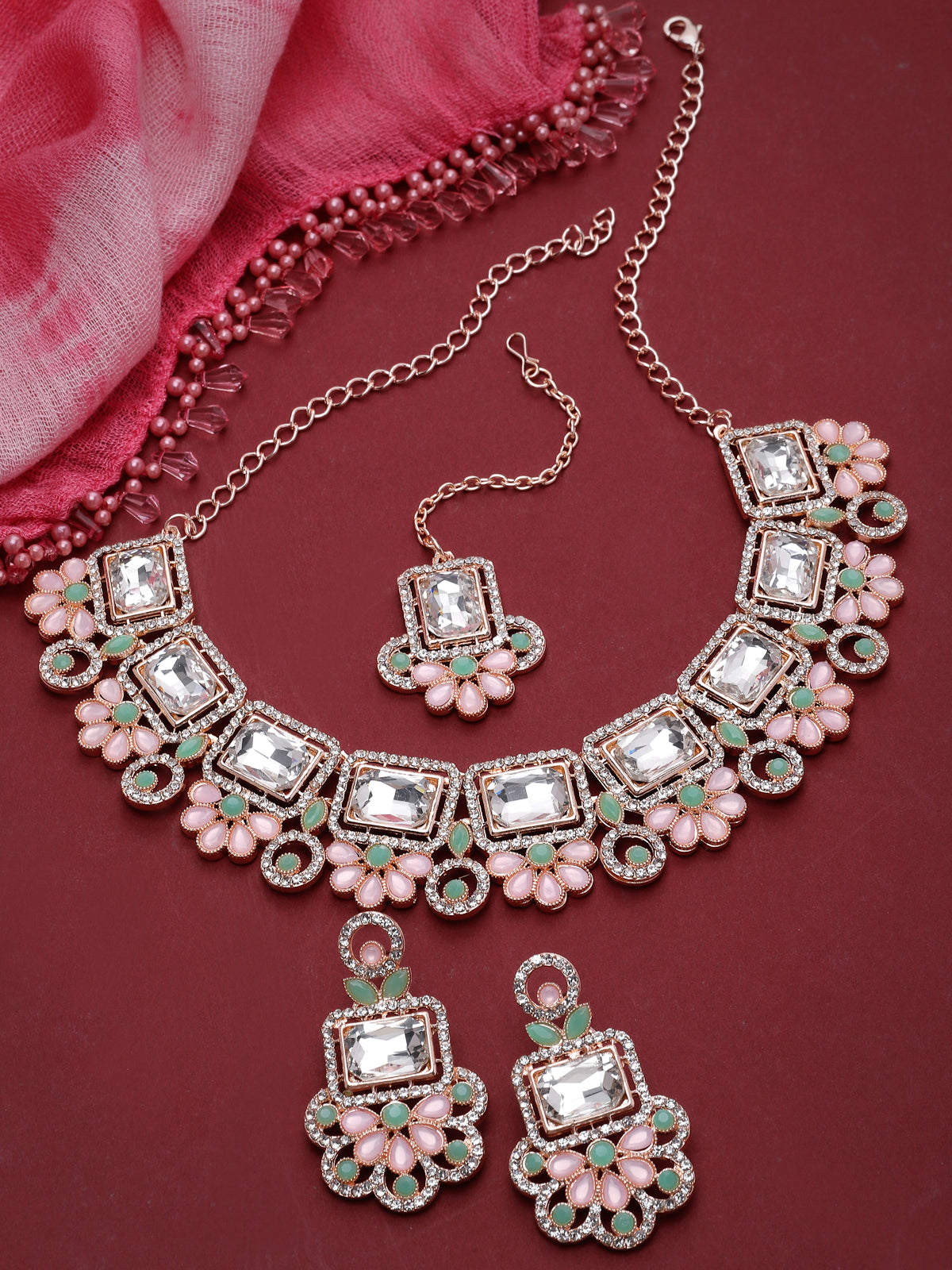Sukkhi Good-Looking Rose Gold Plated Pink & Mint Green AD Stone Collar Bone Necklace Set With Earring And Maangtika | Jewellery Set For Women (NS105487)