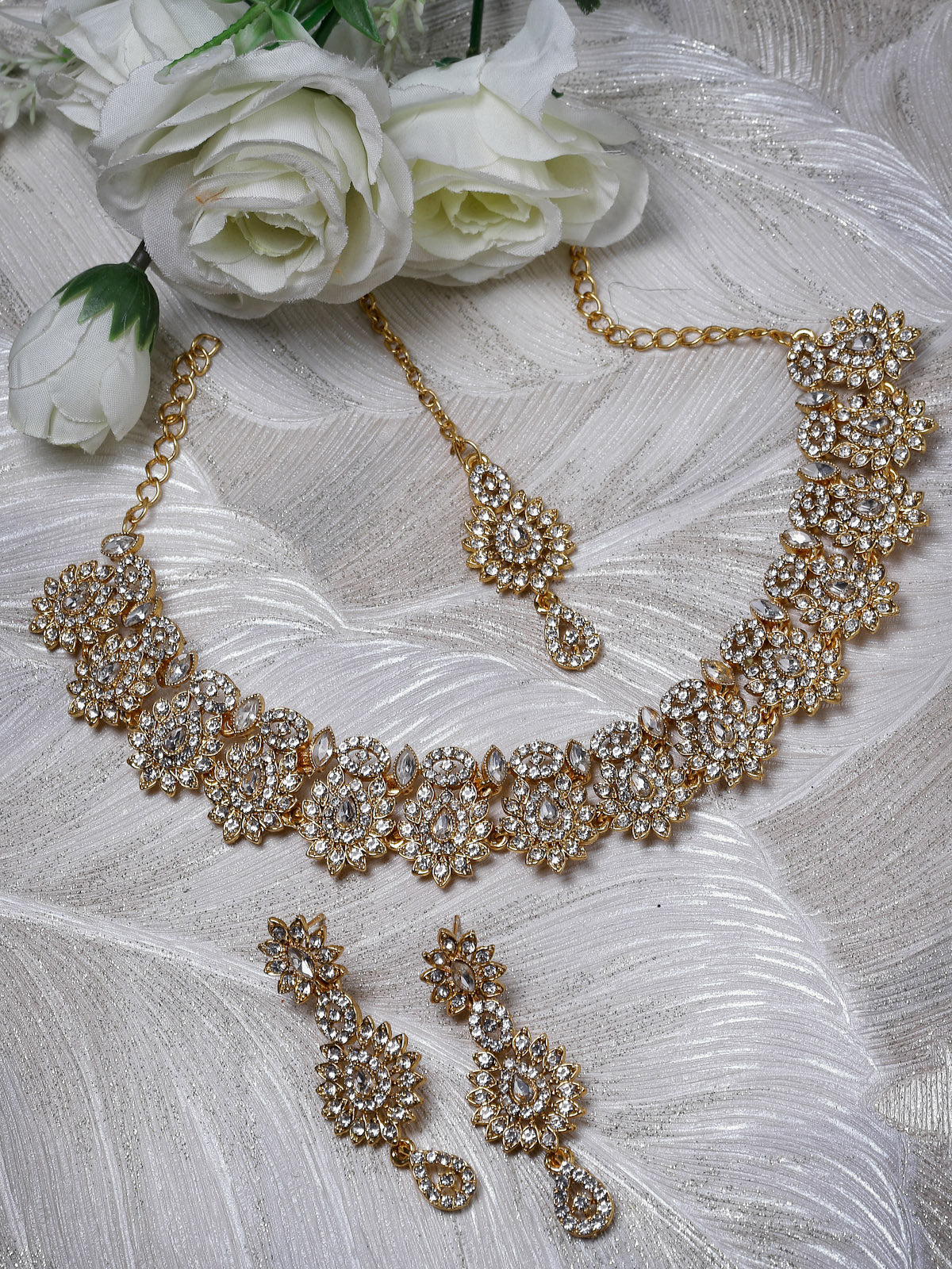 Sukkhi Eye-Catching Gold Plated AD Stone Collar Bone Necklace Set With Earring And Maangtika | Jewellery Set For Women (NS105647)