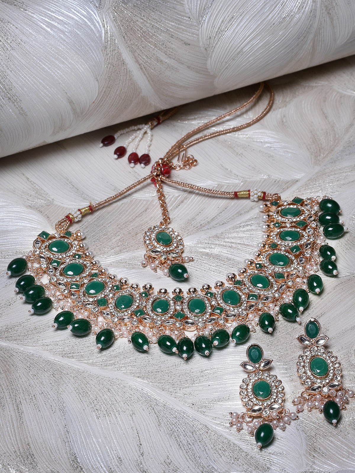 Sukkhi Bright Gold Plated AD Green Stones With Drop Beads Collar Bone Necklace Set With Earring And Maangtika | Jewellery Set For Women (NS105717)