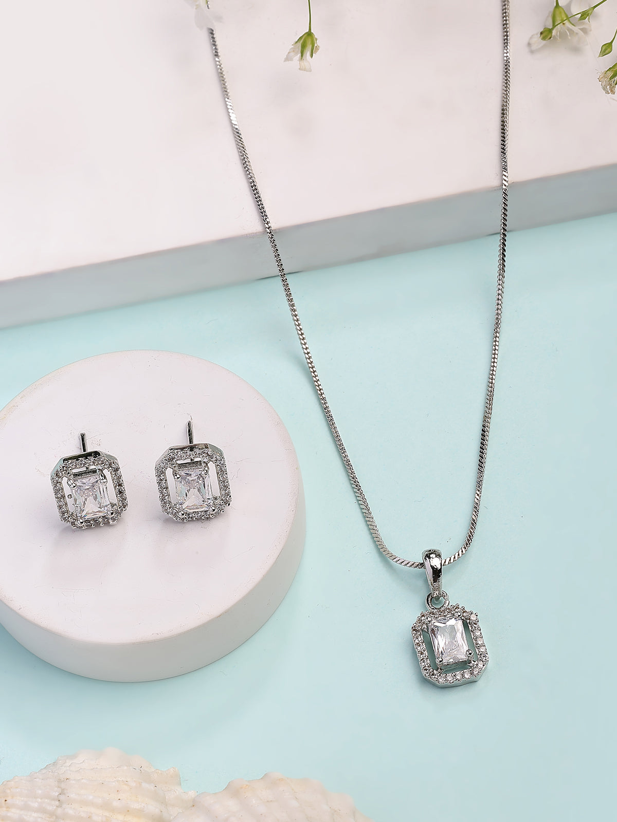 Sukkhi Most Beautiful Stylish Rhodium Plated Silver Toned White Cubic Zirconia Studded Pendant with Chain & Studs Earrings Jewellery Set for Women & Girls |NS107372