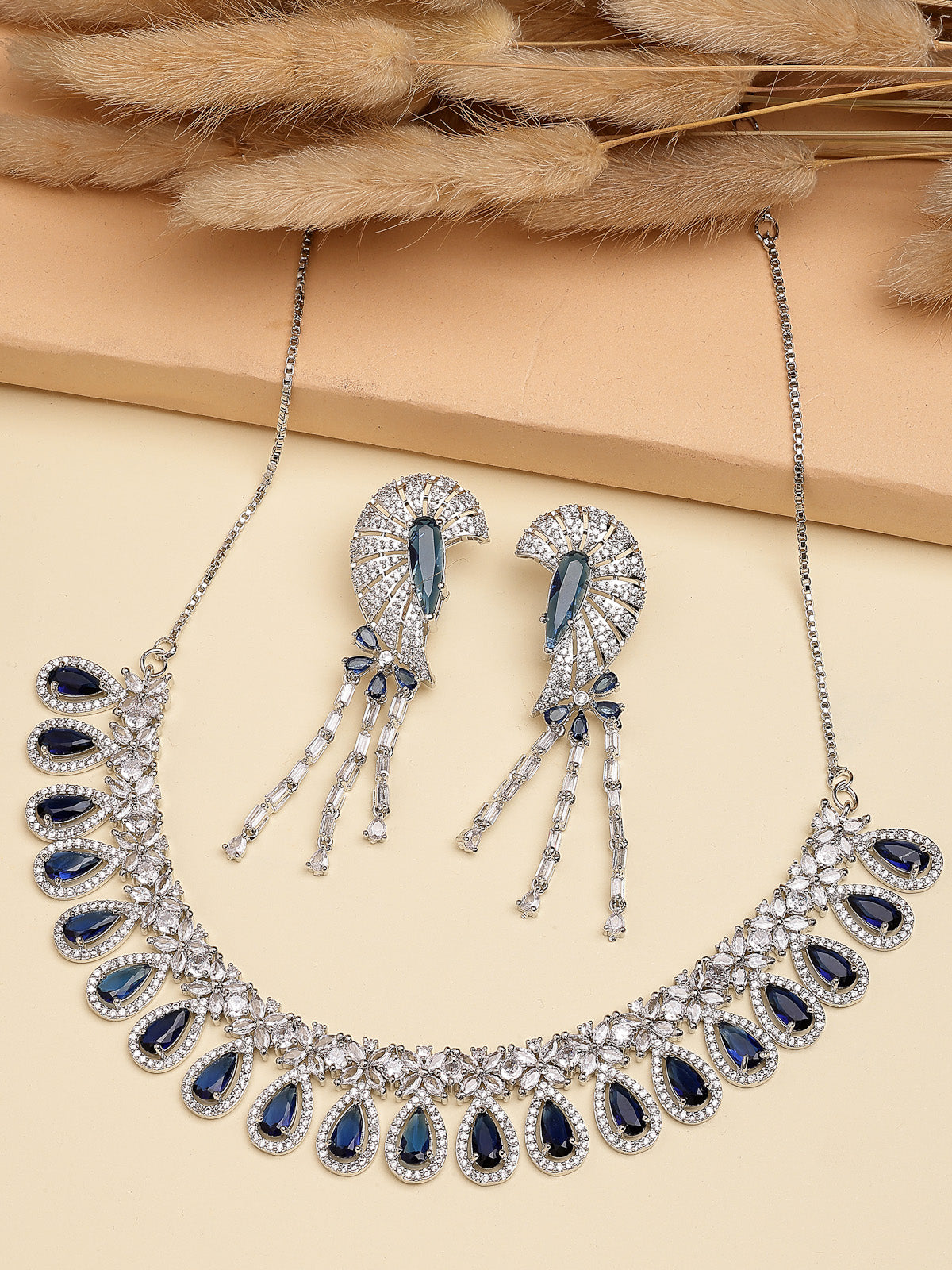 Sukkhi Lavish Fashionable Rhodium Plated Silver Toned & American Diamond StudsDrop Shaped Blue Choker Necklace With Dangle Earring Jewellery Set for Women & Girls|NS107409