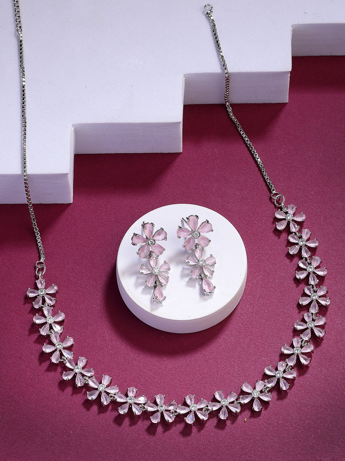 Sukkhi Attractive Rhodium Plated Silver Toned with American Diamond Studded Floral Shaped Pink Choker Necklace with Drop Earring Jewellery Set For Women & Girls|NS107417