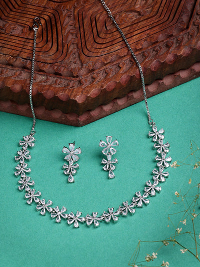 Sukkhi Attractive Rhodium Plated Silver Toned with American Diamond Studded Floral Shaped Choker Necklace with Drop Earring Jewellery Set For Women & Girls|NS107419