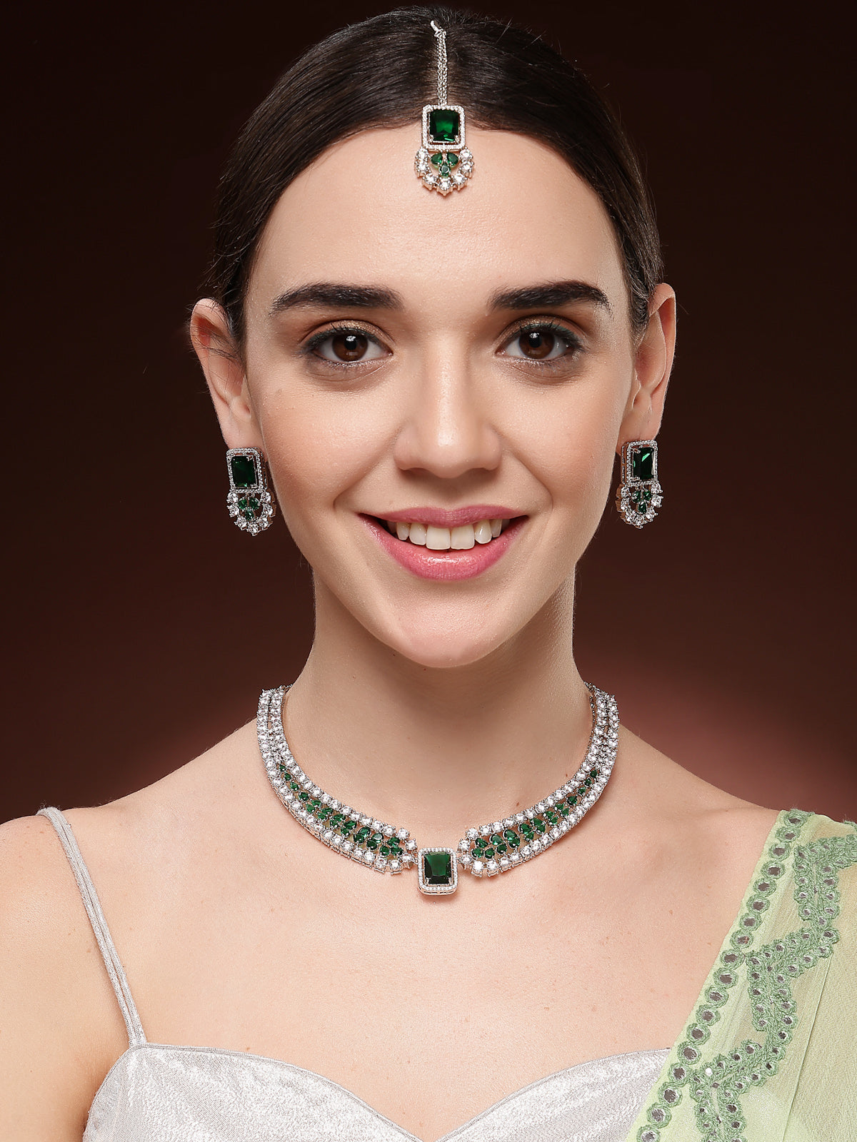 Sukkhi Latest Stylish Rhodium Plated Cubic Zirconia Studded Brass  Emerald Green Collar Necklace & Studs Earring & Maangtikka Jewellery Set for Women|Latest Stylish Gifts for All Occasions|NS115977