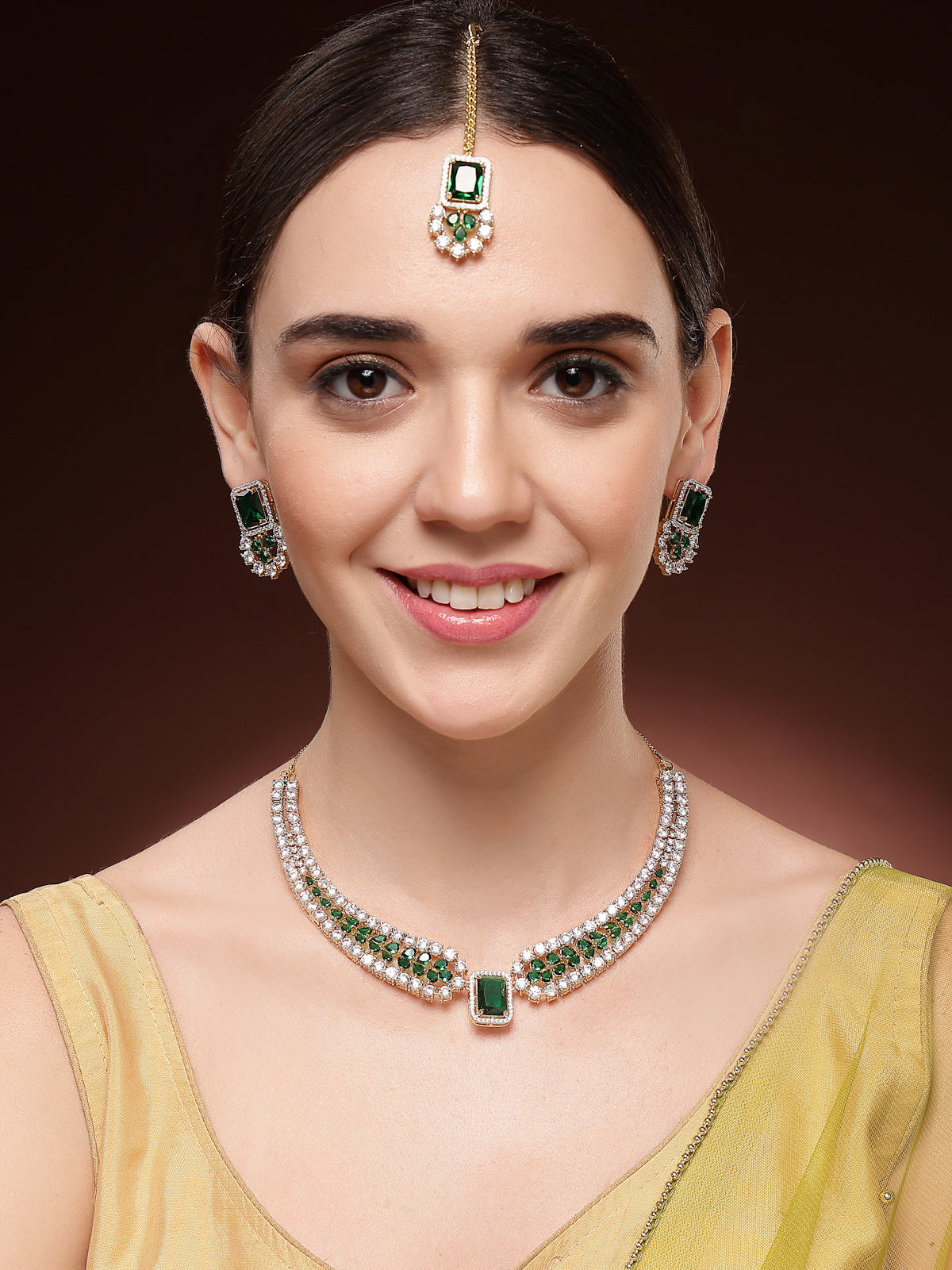 Sukkhi Wedding Collection Gold Plated Cubic Zirconia Studded Brass Emerald Green Collar Necklace & Studs Earring & Maangtikka Jewellery Set for Women|Latest Stylish Gifts for All Occasions|NS115982