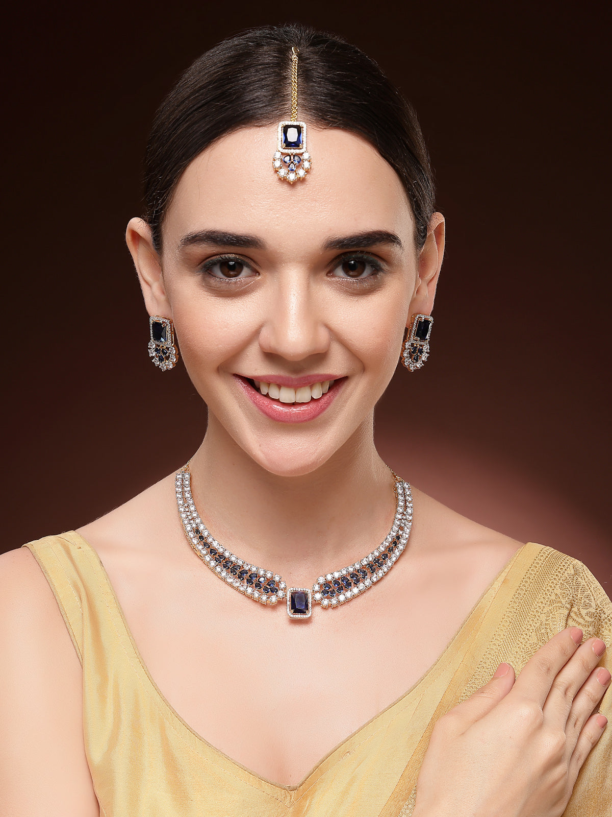 Sukkhi Sparkling Royal Blue Gold Plated with Cubic Zirconia Studded Brass Collar Necklace with Studs Earring & Maangtikka Jewellery Set for Women|Latest Stylish Gifts for All Occasions|NS115983