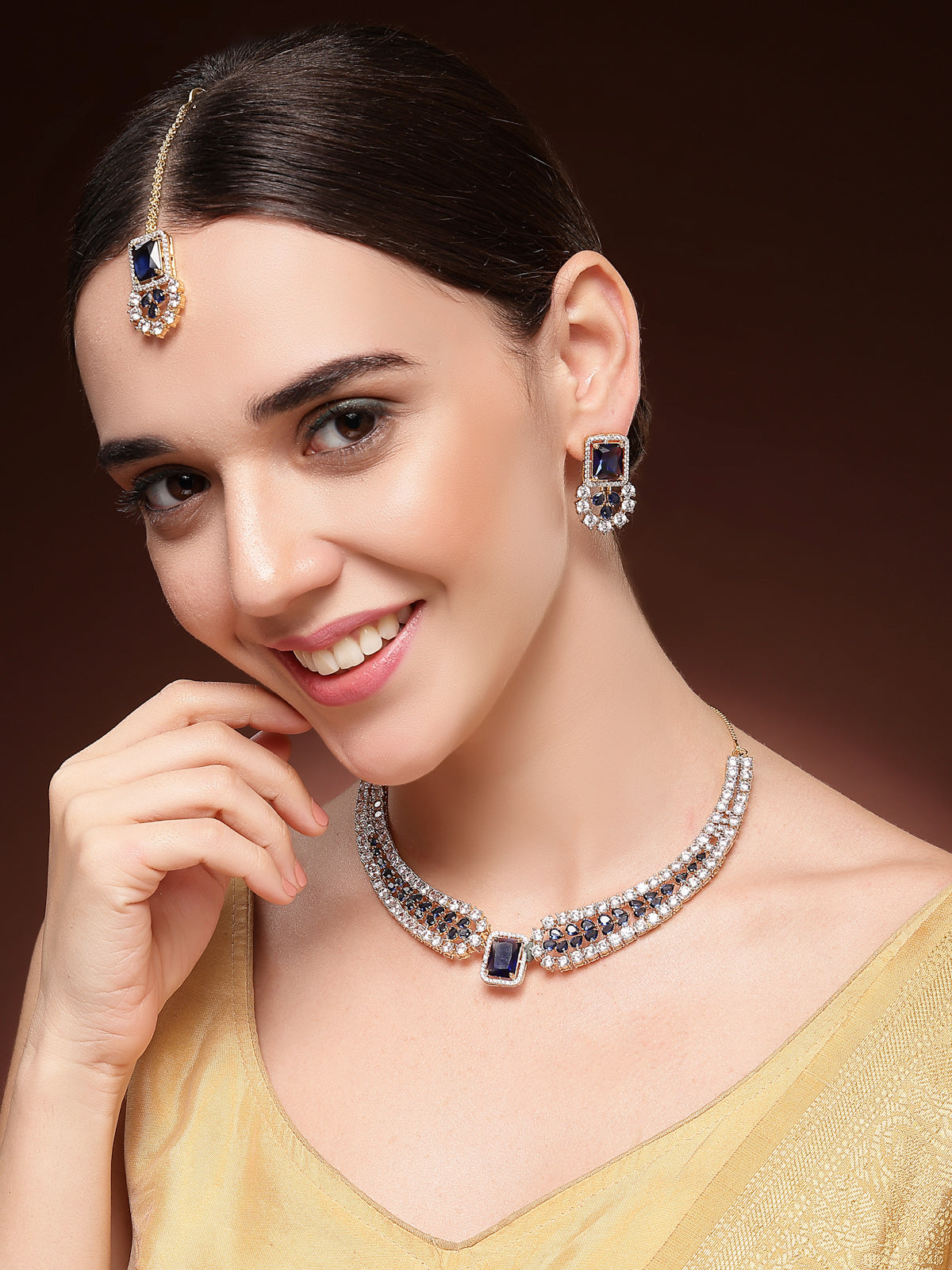 Sukkhi Sparkling Royal Blue Gold Plated with Cubic Zirconia Studded Brass Collar Necklace with Studs Earring & Maangtikka Jewellery Set for Women|Latest Stylish Gifts for All Occasions|NS115983