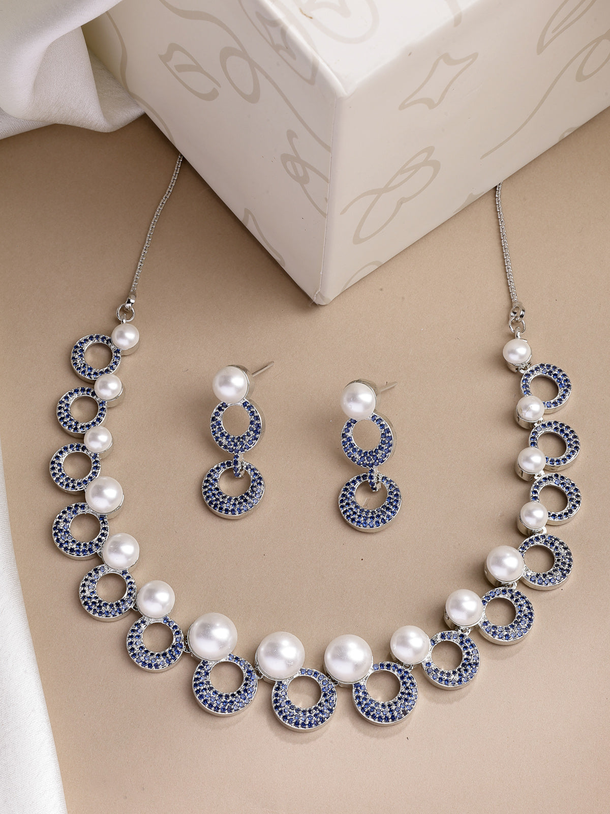 Sukkhi Eye Catchy Rhodium Plated with Cubic Zirconia & Pearl Studded Blue Round Brass Collar Necklace with Drop Earrings Jewellery Set for Women|Latest Stylish Gifts for All Occasions|NS116020