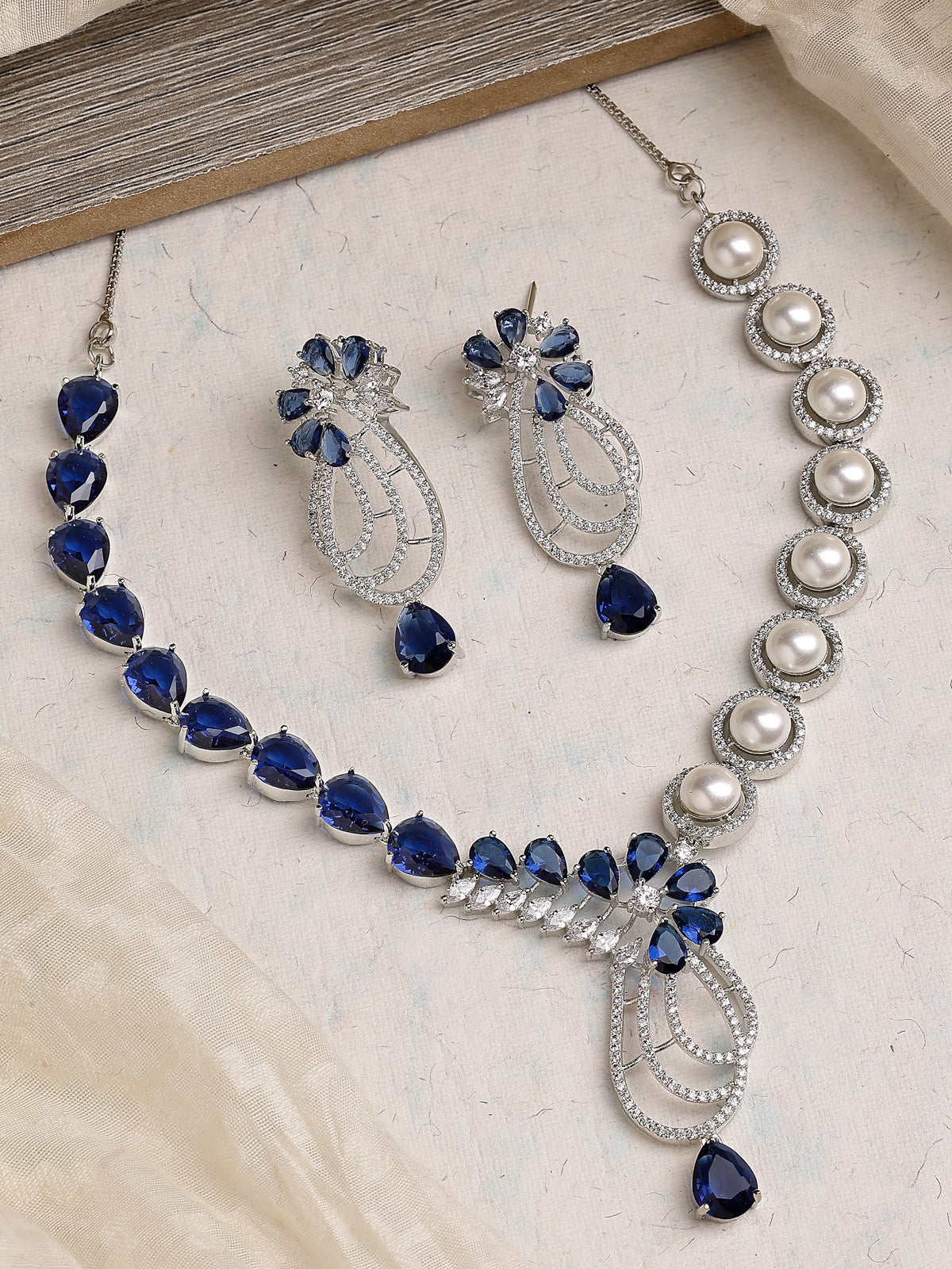 Sukkhi Classic Tear Drop Round Design Rhodium Plated Cubic Zirconia & Pearl Studded Blue Brass Collar Necklace & Drop Earrings Jewellery Set for Women|Latest Stylish Gifts for All Occasions|NS116057