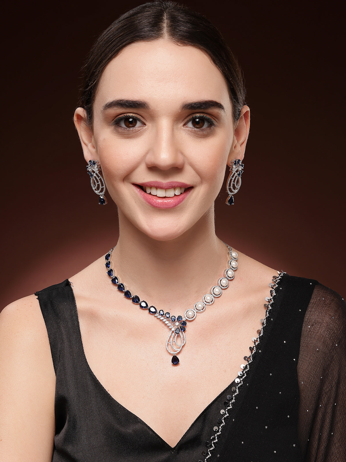 Sukkhi Classic Tear Drop Round Design Rhodium Plated Cubic Zirconia & Pearl Studded Blue Brass Collar Necklace & Drop Earrings Jewellery Set for Women|Latest Stylish Gifts for All Occasions|NS116057