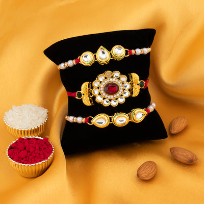 Sukkhi Floral Gold Plated Kundan and Pearl Rakhi Combo (Set of 3) with Roli Chawal and Raksha Bandhan Greeting Card For Men