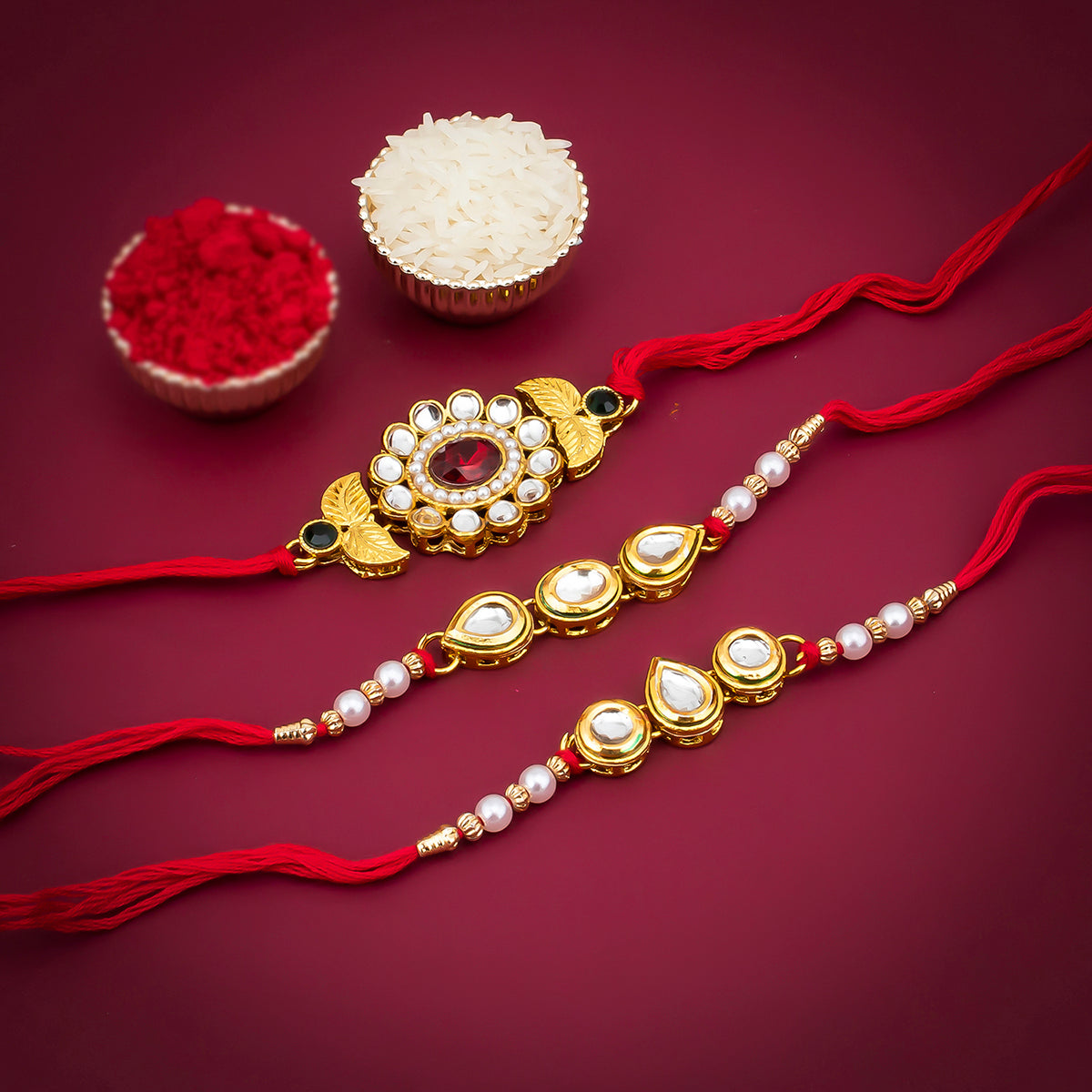 Sukkhi Floral Gold Plated Kundan and Pearl Rakhi Combo (Set of 3) with Roli Chawal and Raksha Bandhan Greeting Card For Men