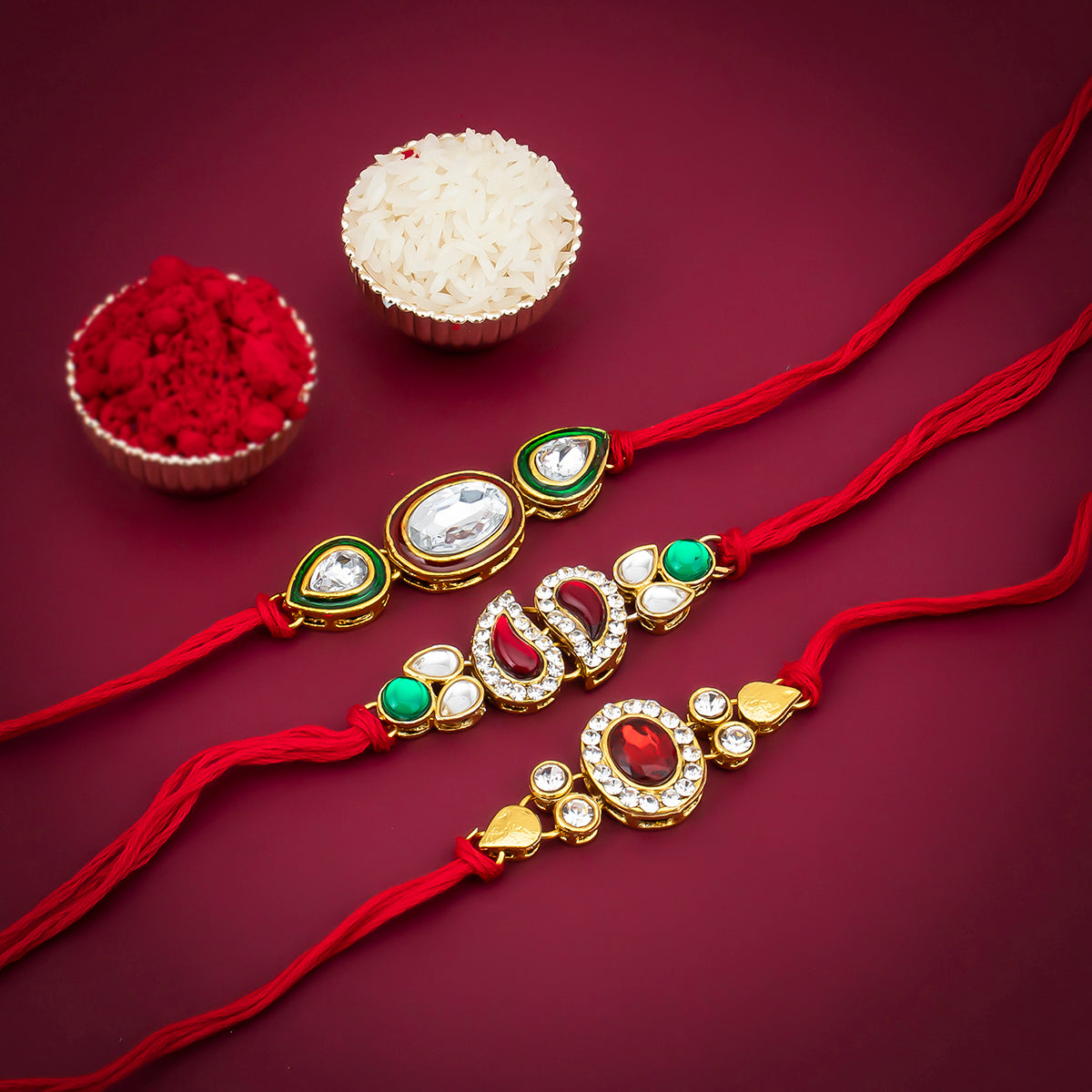 Sukkhi Elegant Gold Plated Austrian Diamond Rakhi Combo (Set of 3) with Roli Chawal and Raksha Bandhan Greeting Card For Men