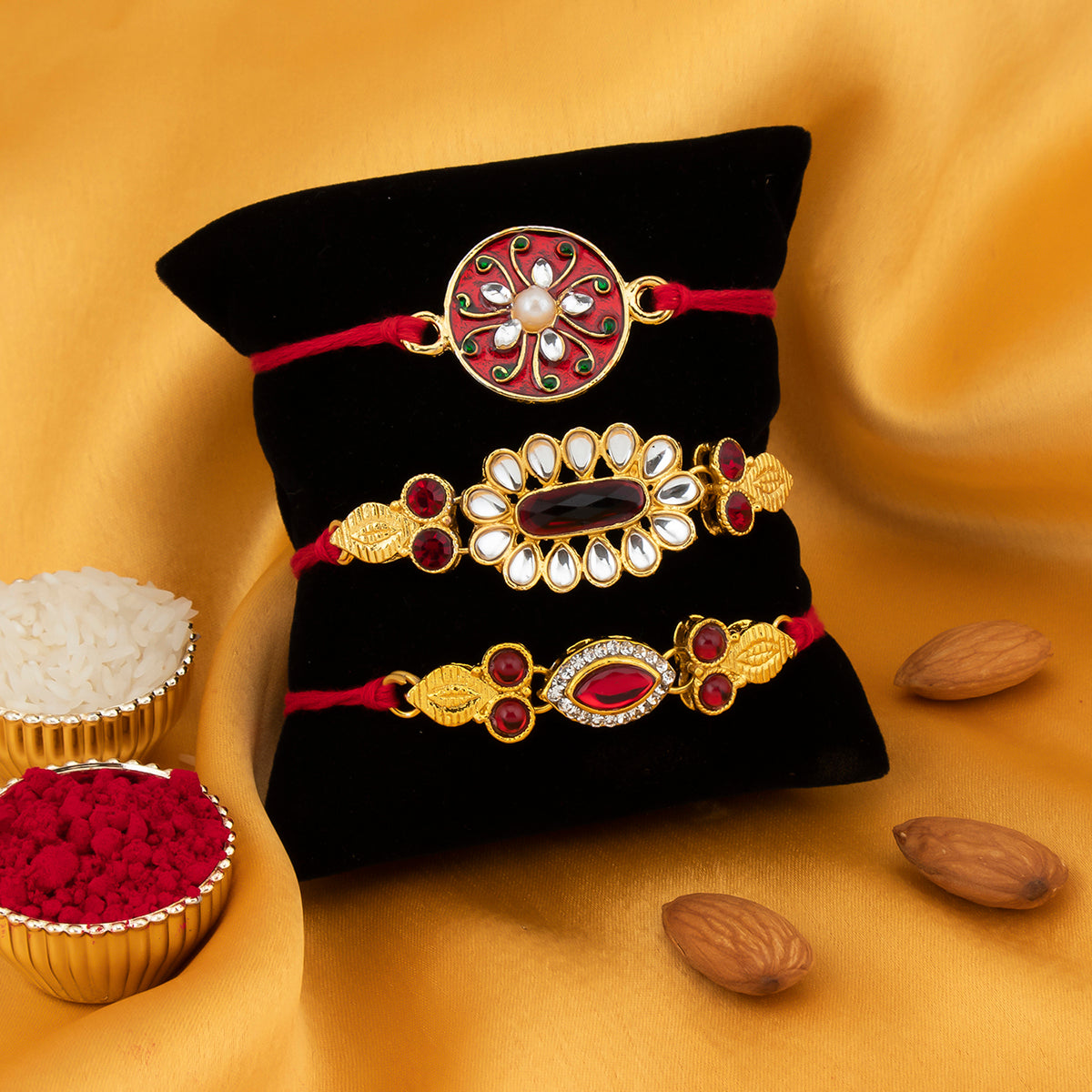 Sukkhi Eye-Catchy Gold Plated Kundan Meenakari Rakhi Combo (Set of 3) with Roli Chawal and Raksha Bandhan Greeting Card For Men