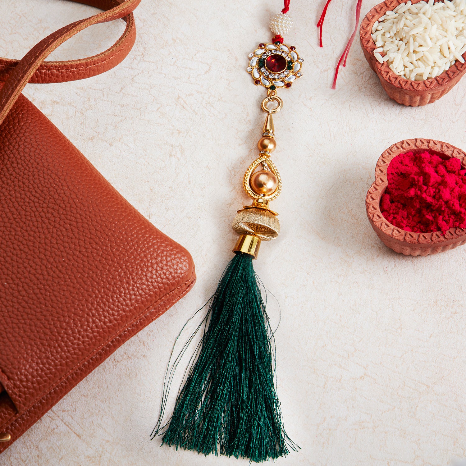 Sukkhi Exclusive Gold Plated Bhaiya Bhabhi Rakhi Lumba Set with Roli Chawal and Raksha Bandhan Greeting Card