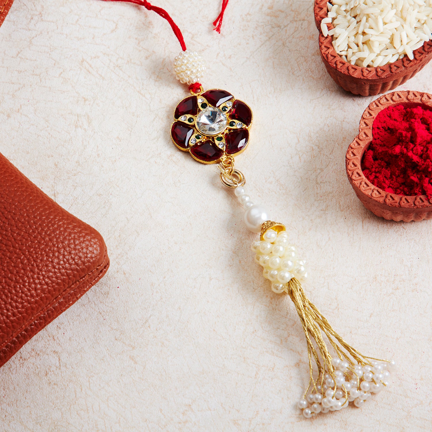 Sukkhi Classic Gold Plated Bhaiya Bhabhi Rakhi Lumba Set with Roli Chawal and Raksha Bandhan Greeting Card